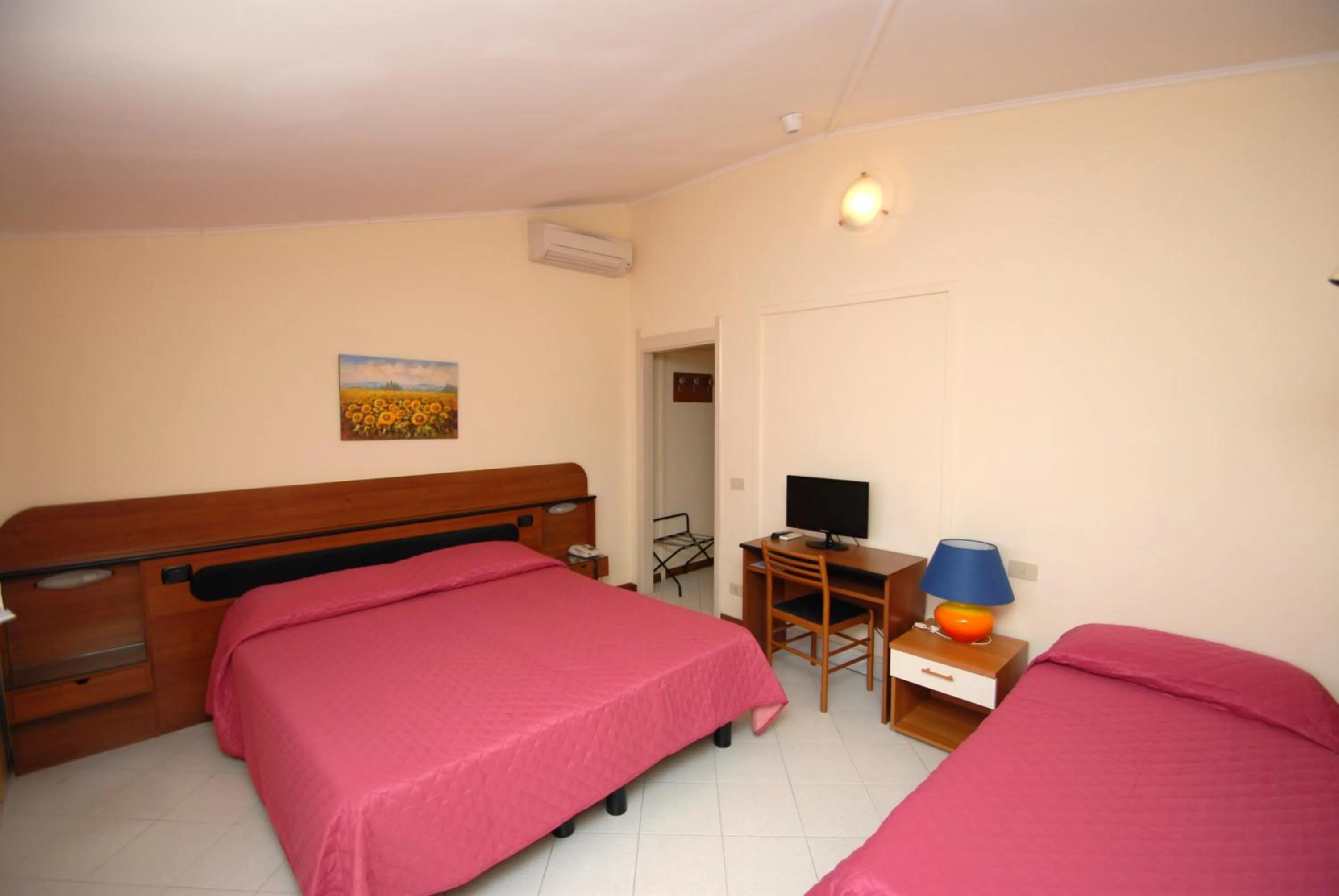 Bed in Hotel Baia Del Sorriso