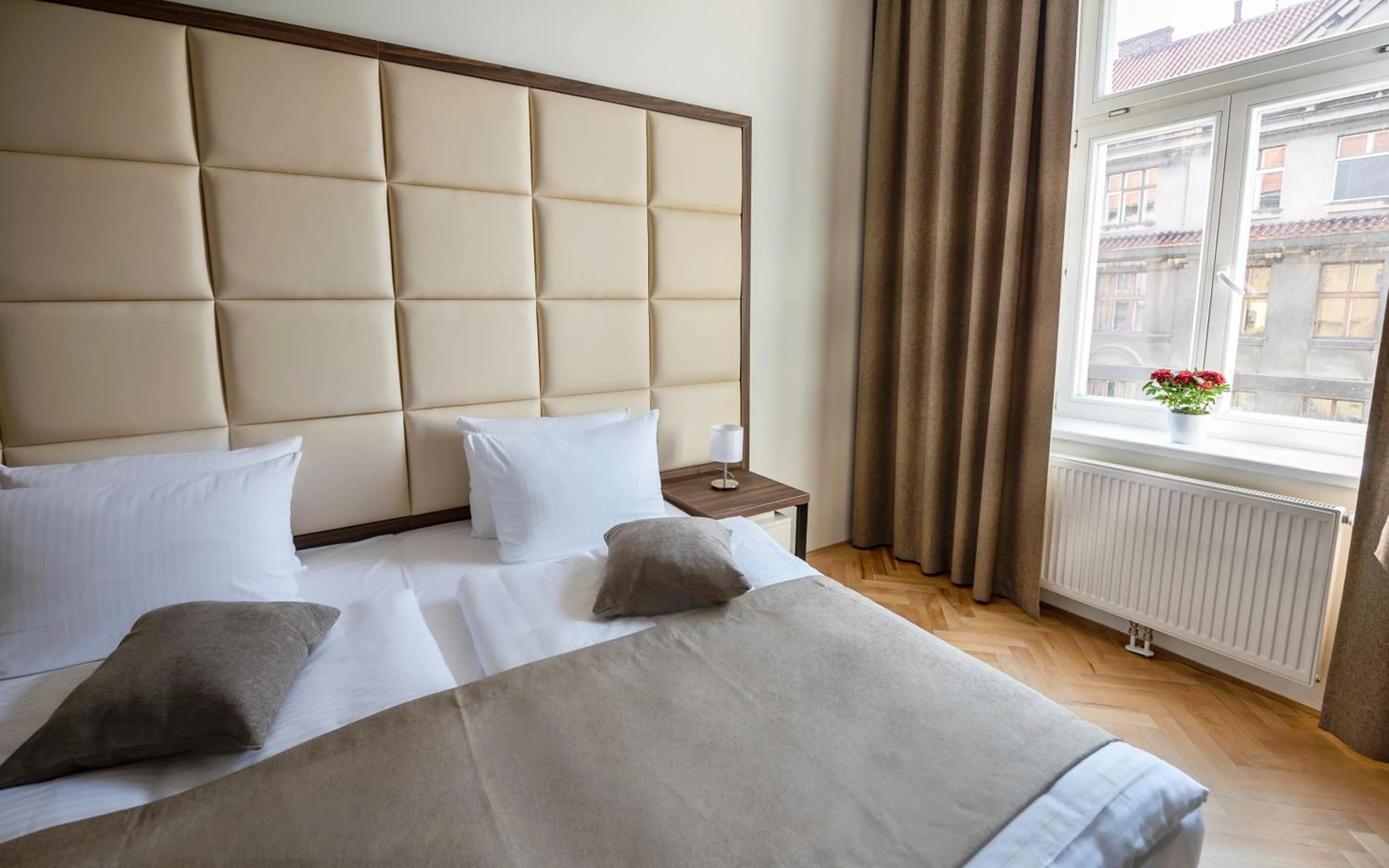 Bed in Letna Garden Suites