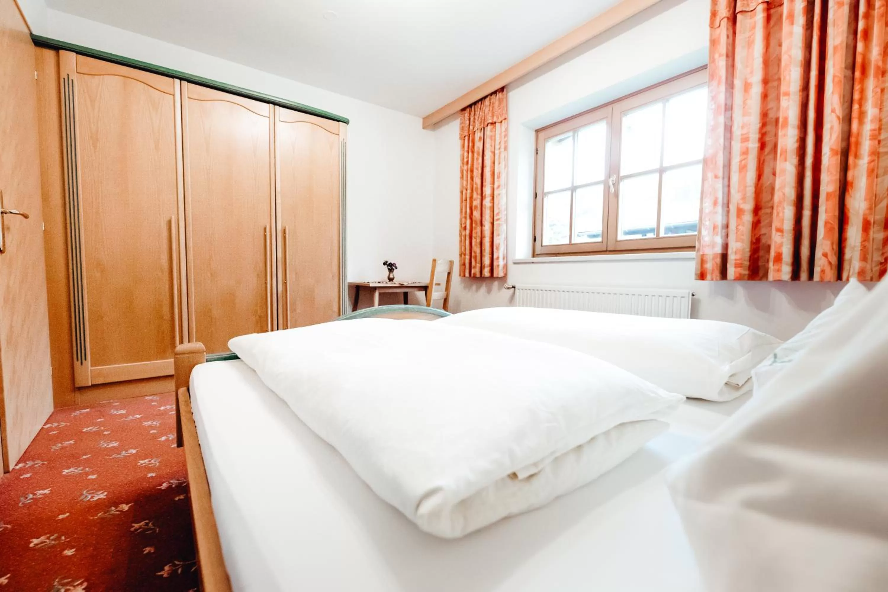 Bed in Zimmer & Ferienwohnungen Dandler