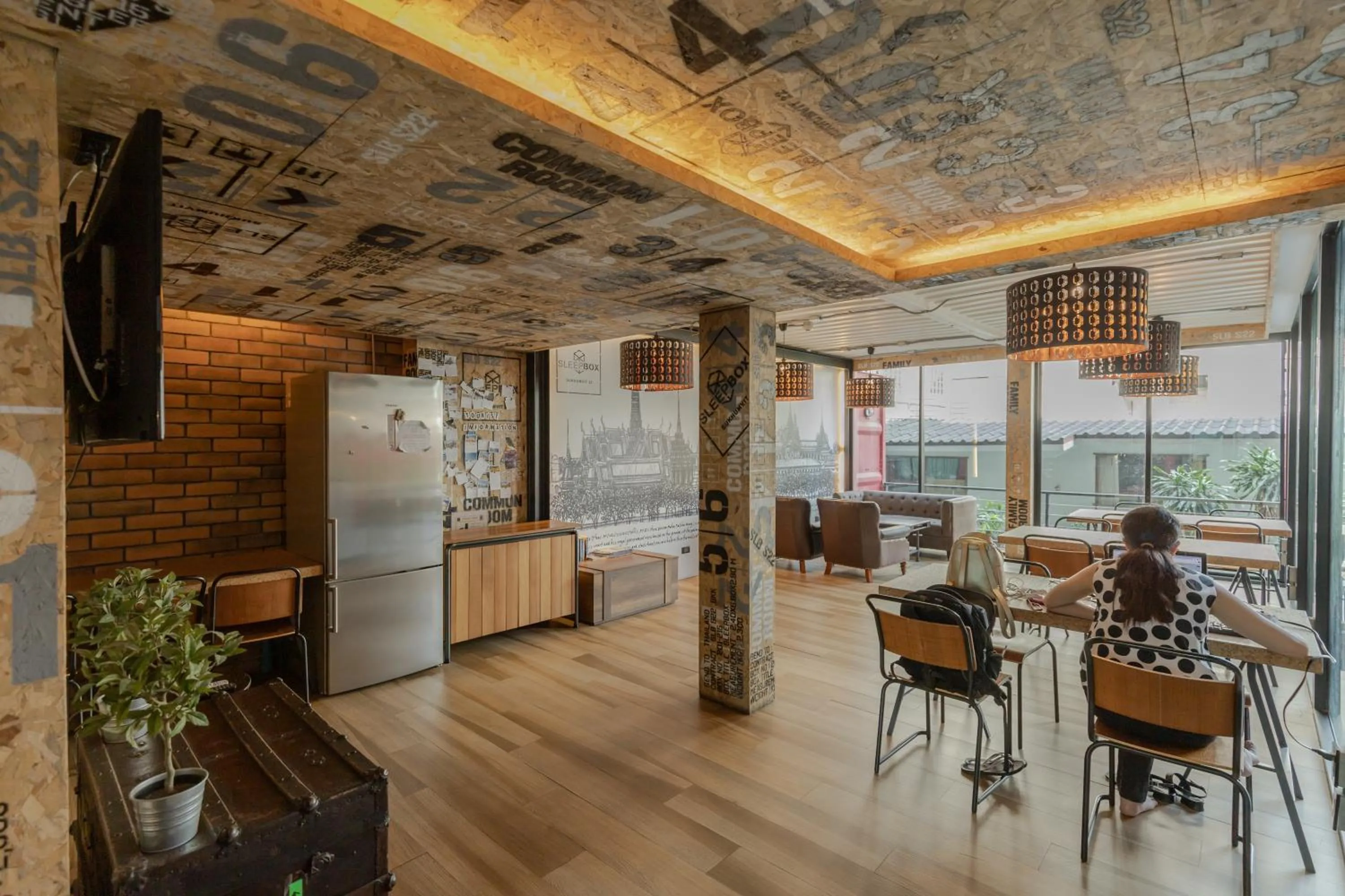 Communal lounge/ TV room in Sleep Box Hotel Sukhumvit 22