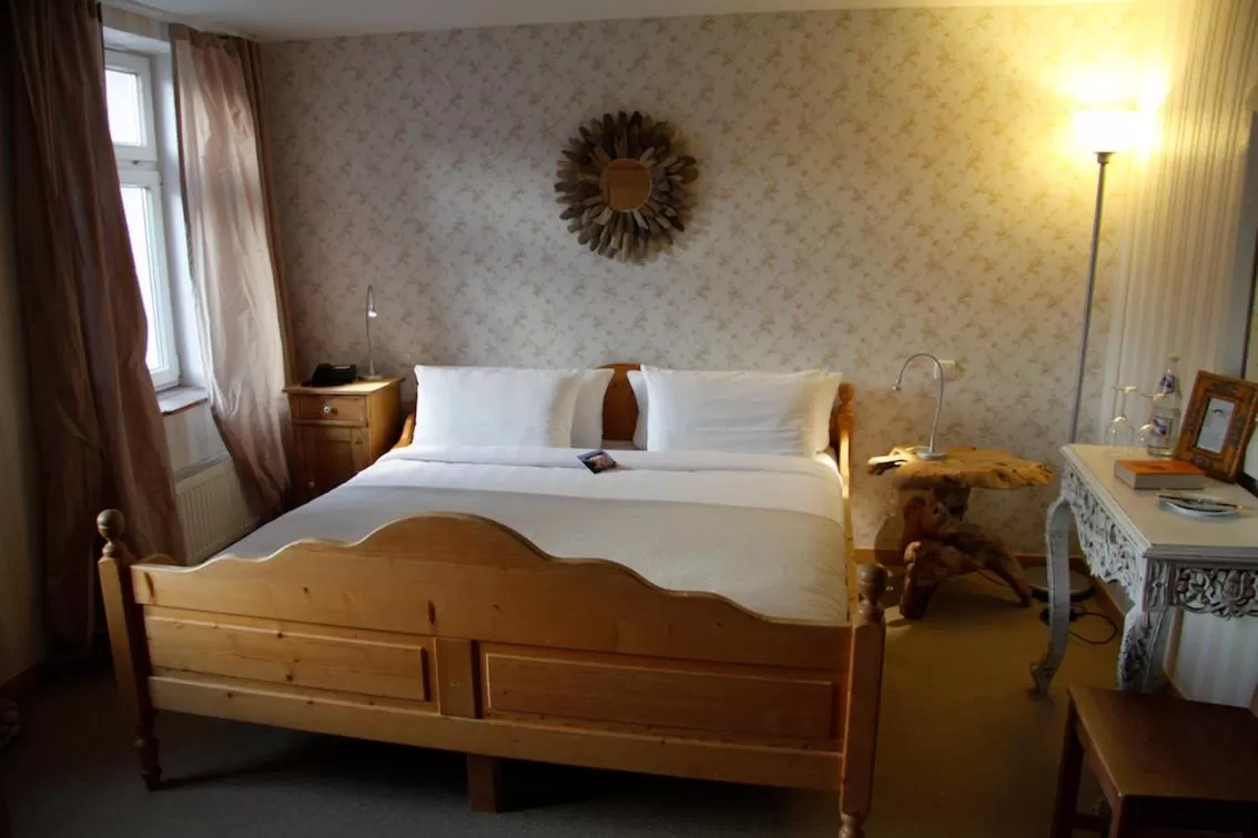 Bed in Zur Ewigen Lampe Romantisches Landhotel & Restaurant