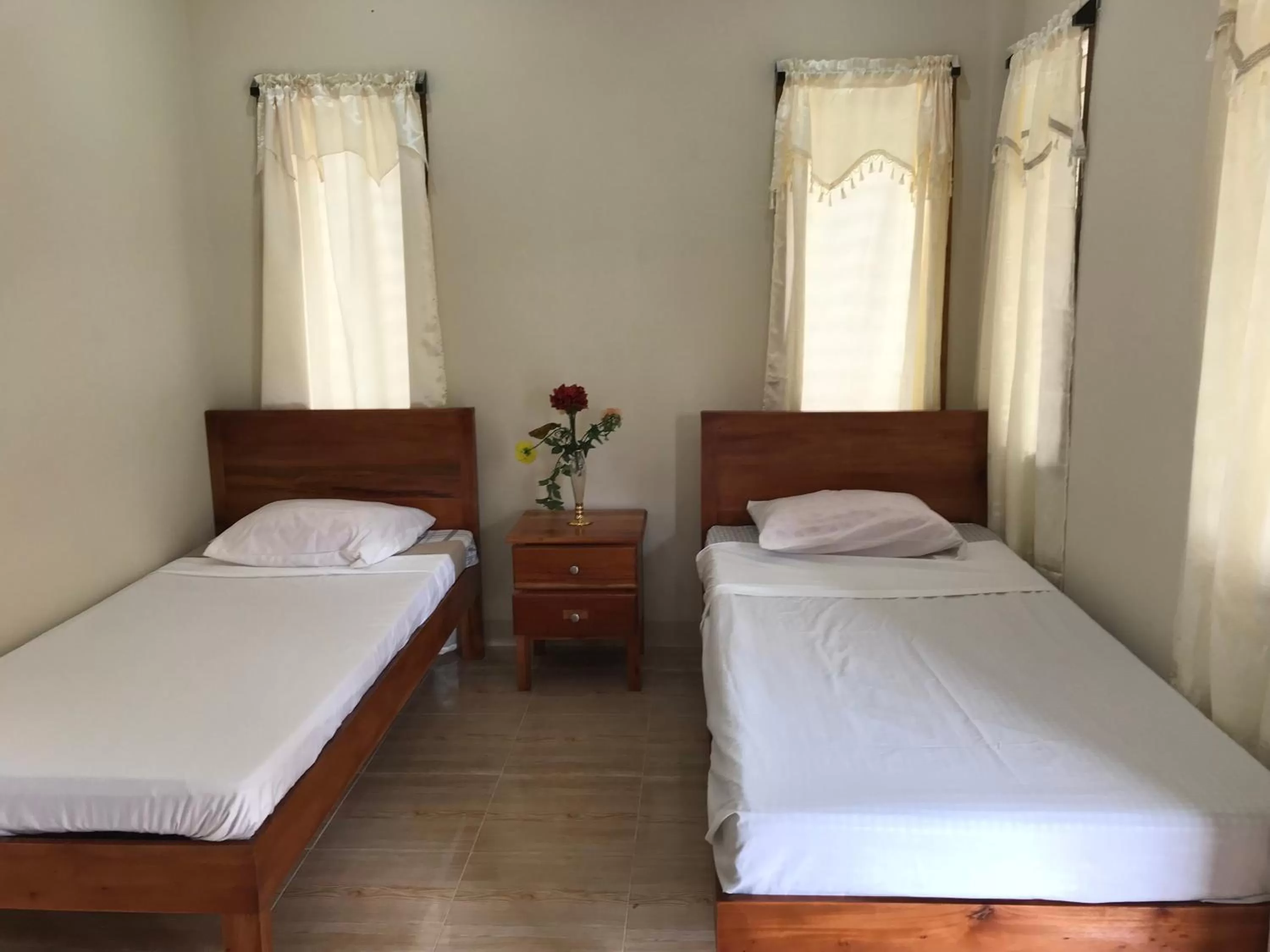 Bed in D's Oceanview Beach Resort