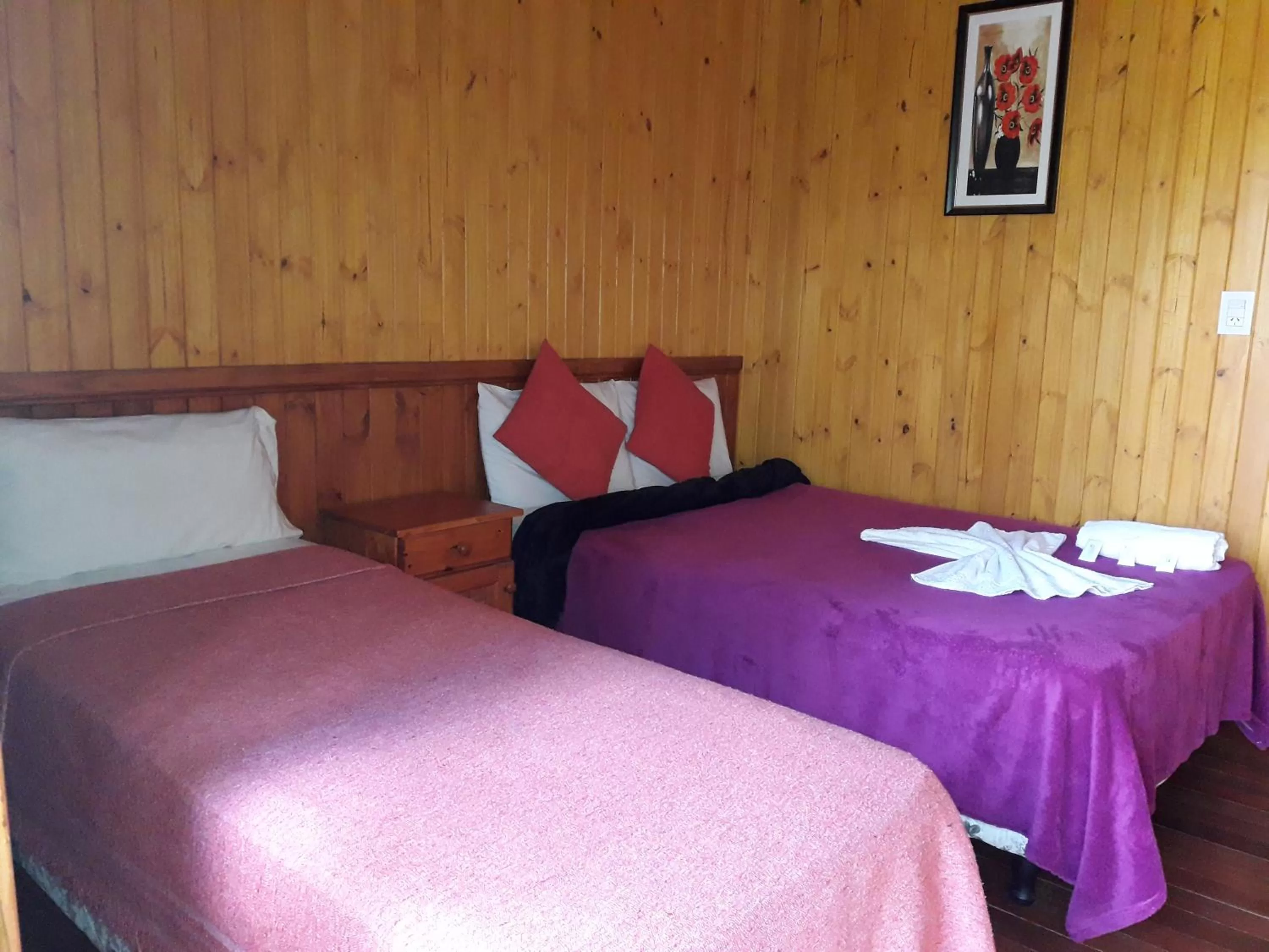 Bed in Petit Hotel Caraguata