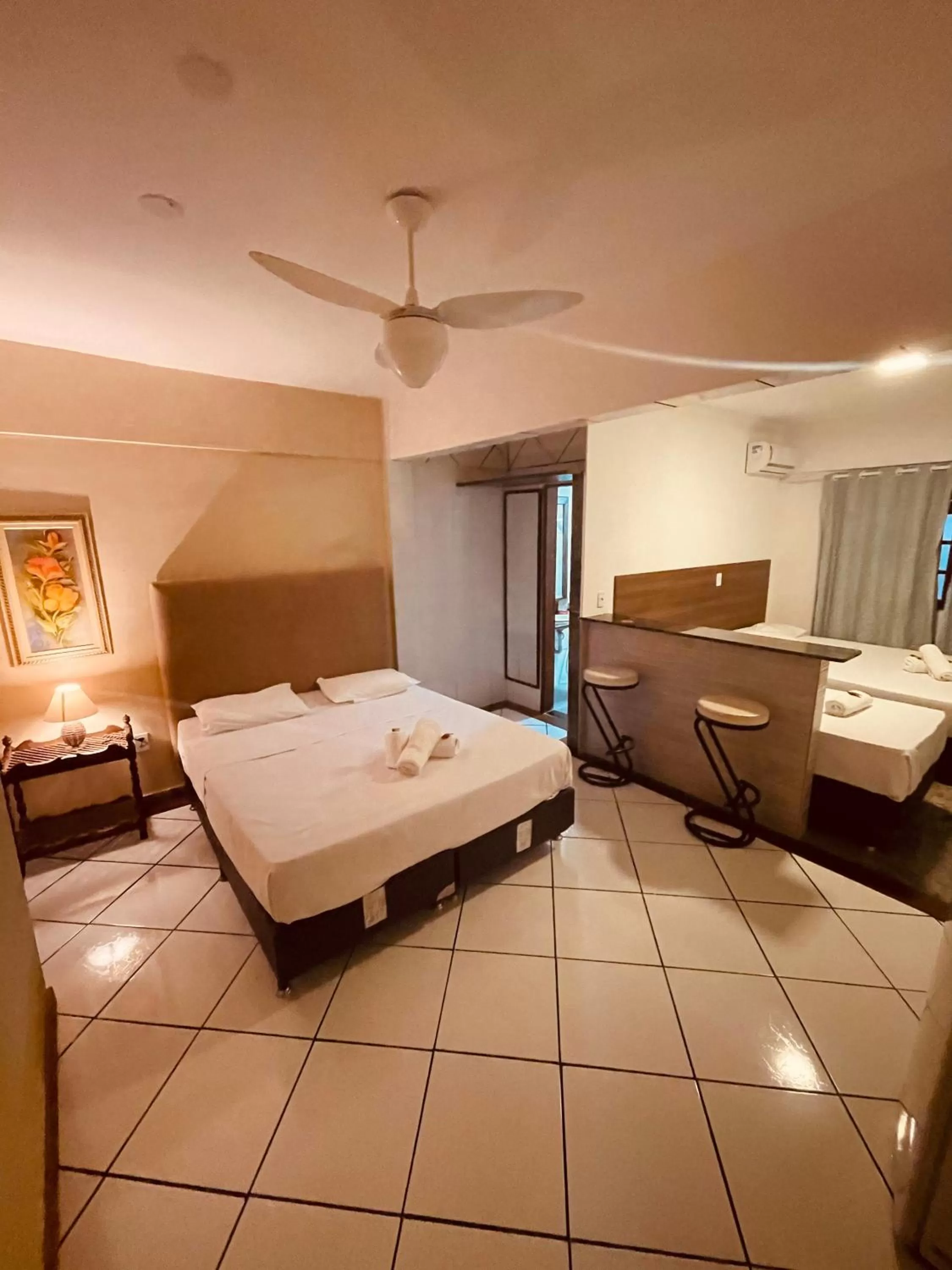 Bed in Flamingo Beach Pousada