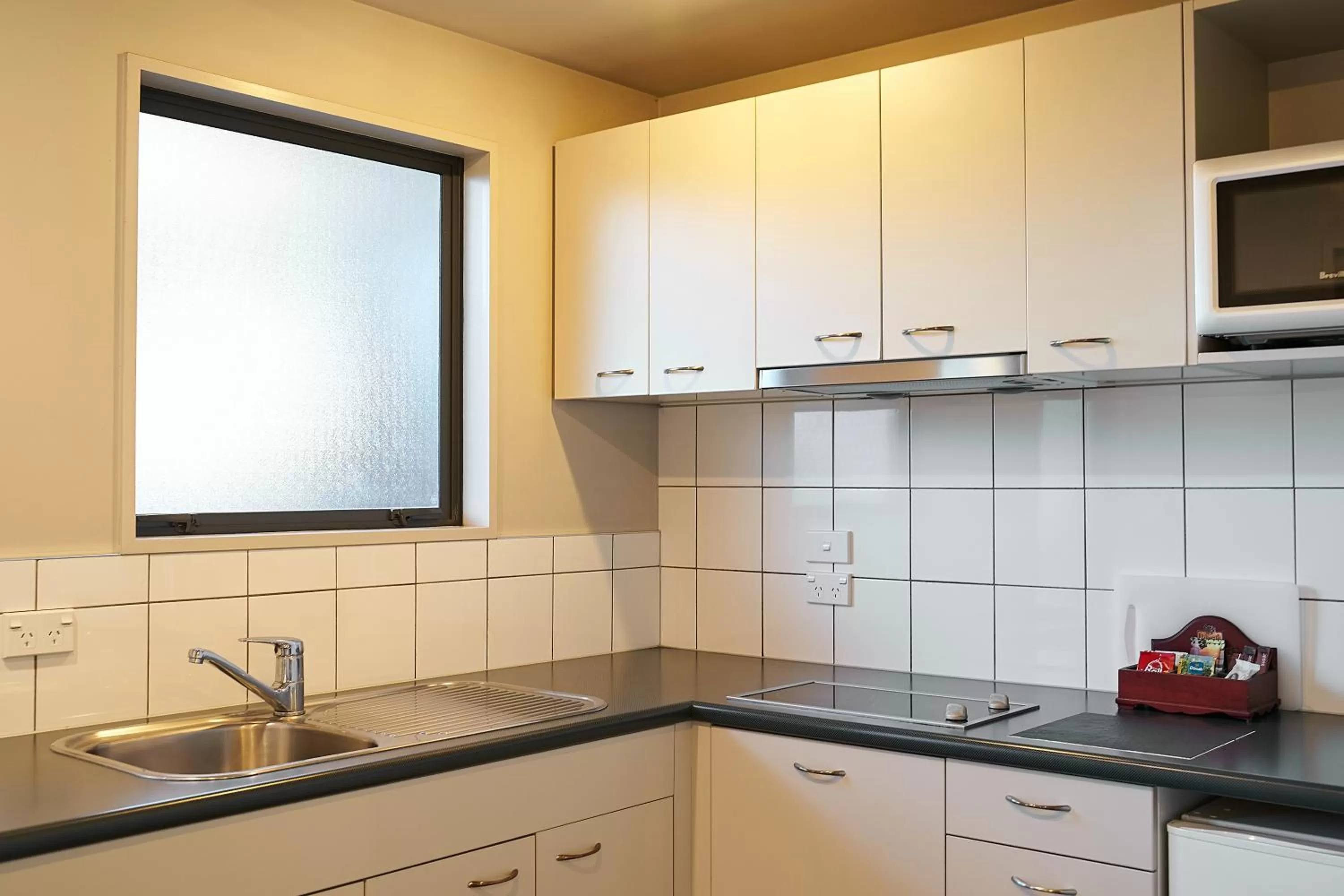 Kitchen or kitchenette in Azena Suites & Apartment