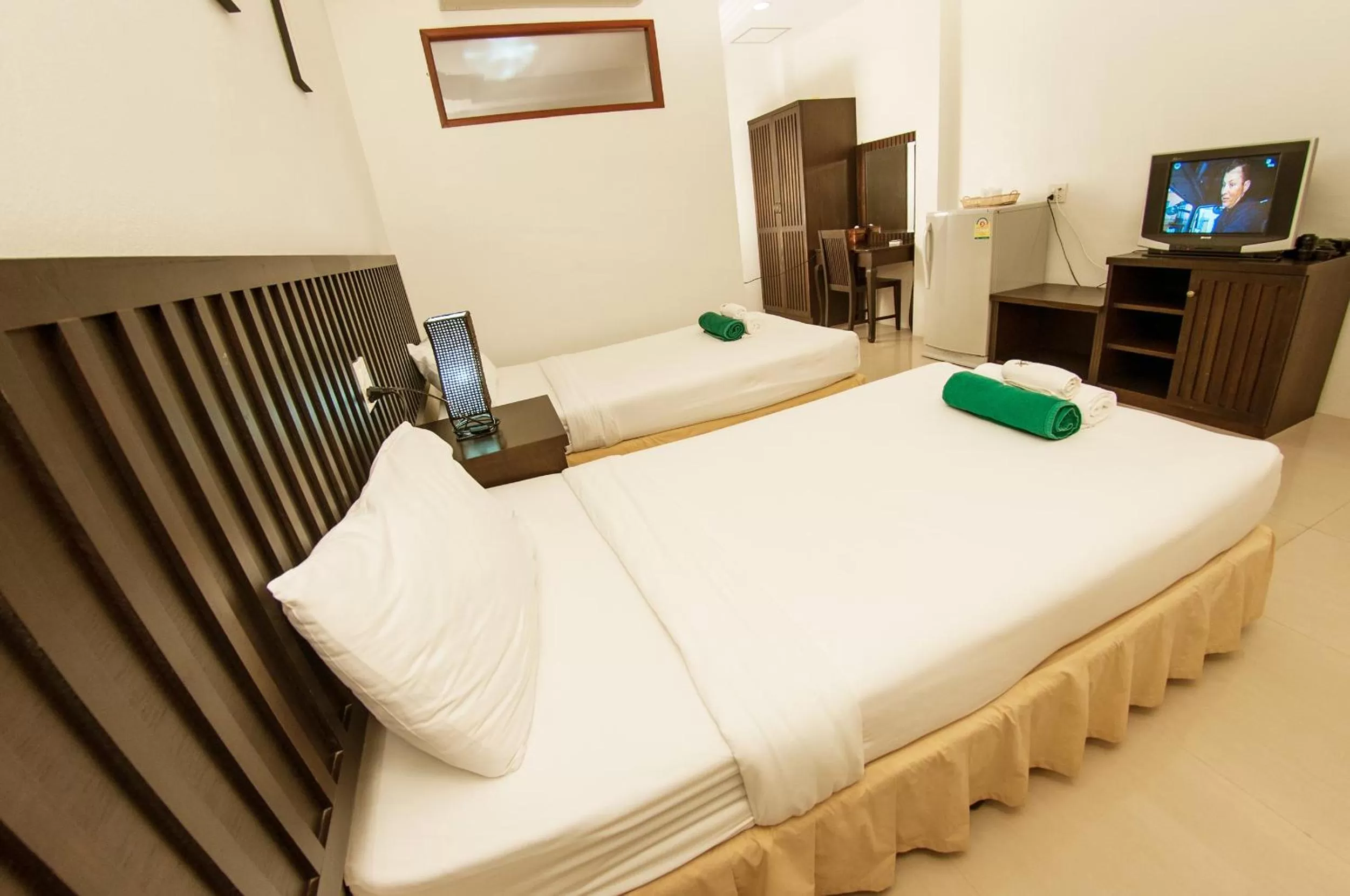 Bed in The Green Beach Resort