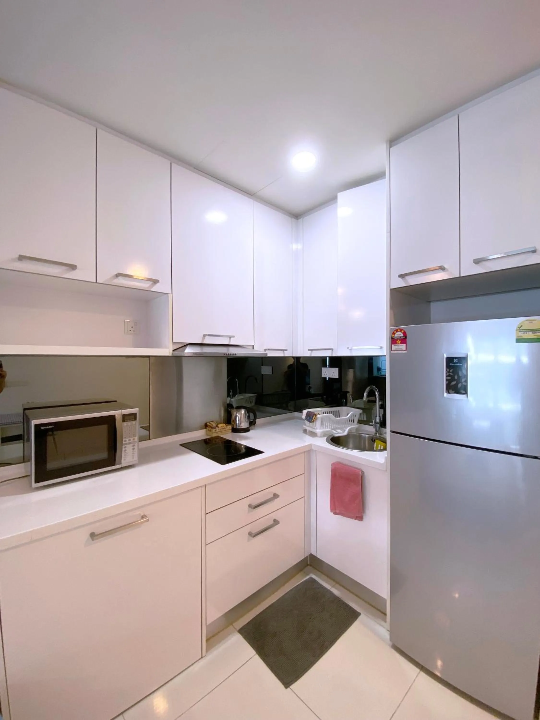 Kitchen/Kitchenette in Mercu Summer Suite KLCC @ Penguin Homes