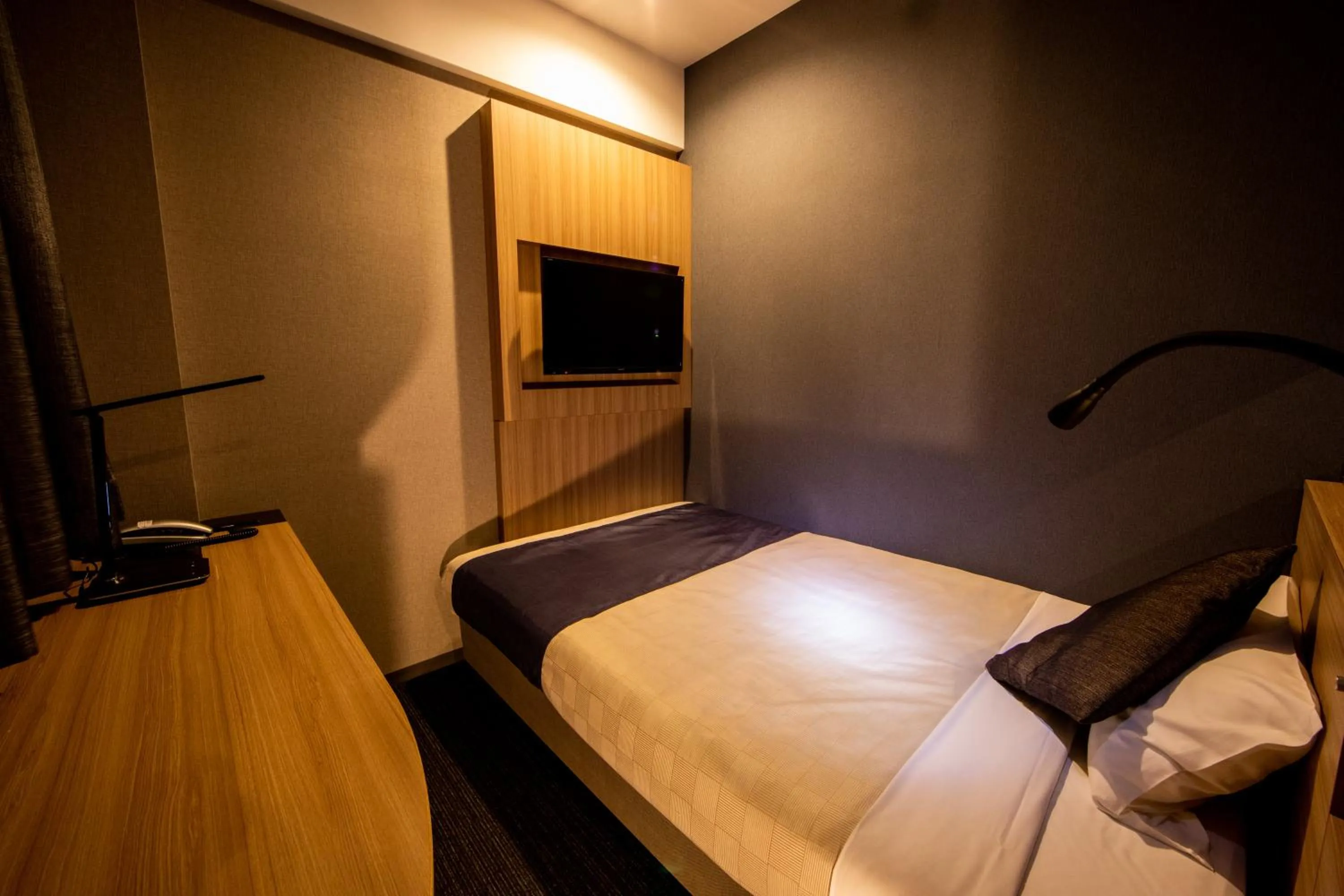 Photo of the whole room, Bed in Quintessa Hotel Osaka Shinsaibashi Comic & Books