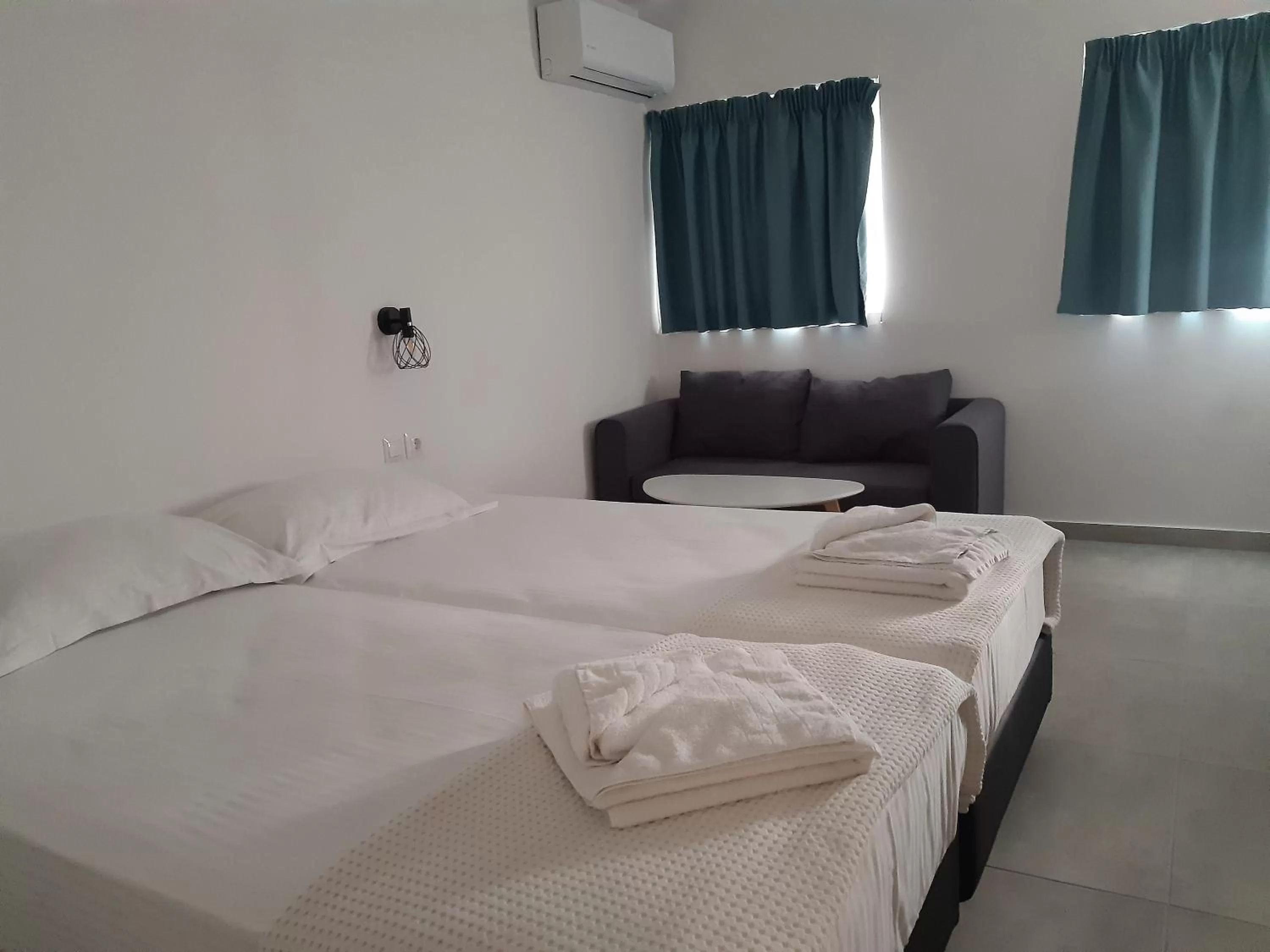 Bed in Evita's Luxury Apartments