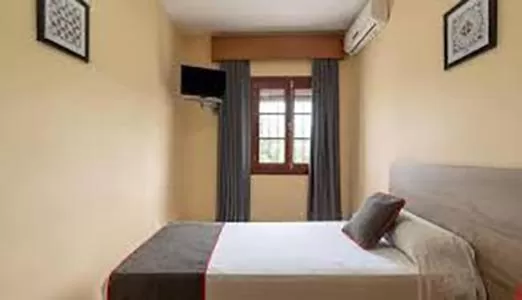 Bed in HOSTAL-RESTAURANTE EL PAISANO