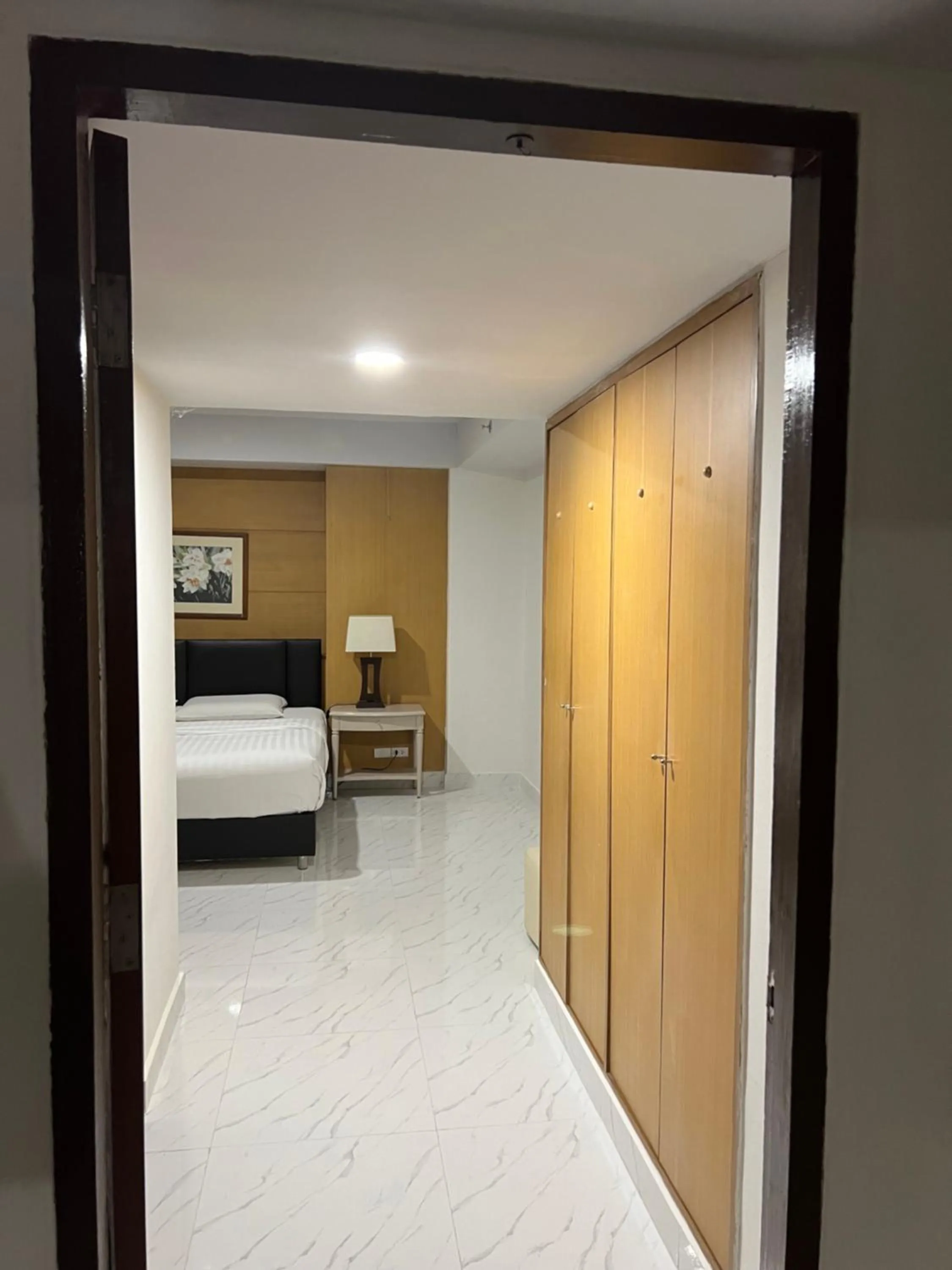 Bed in Mall Suites Hotel