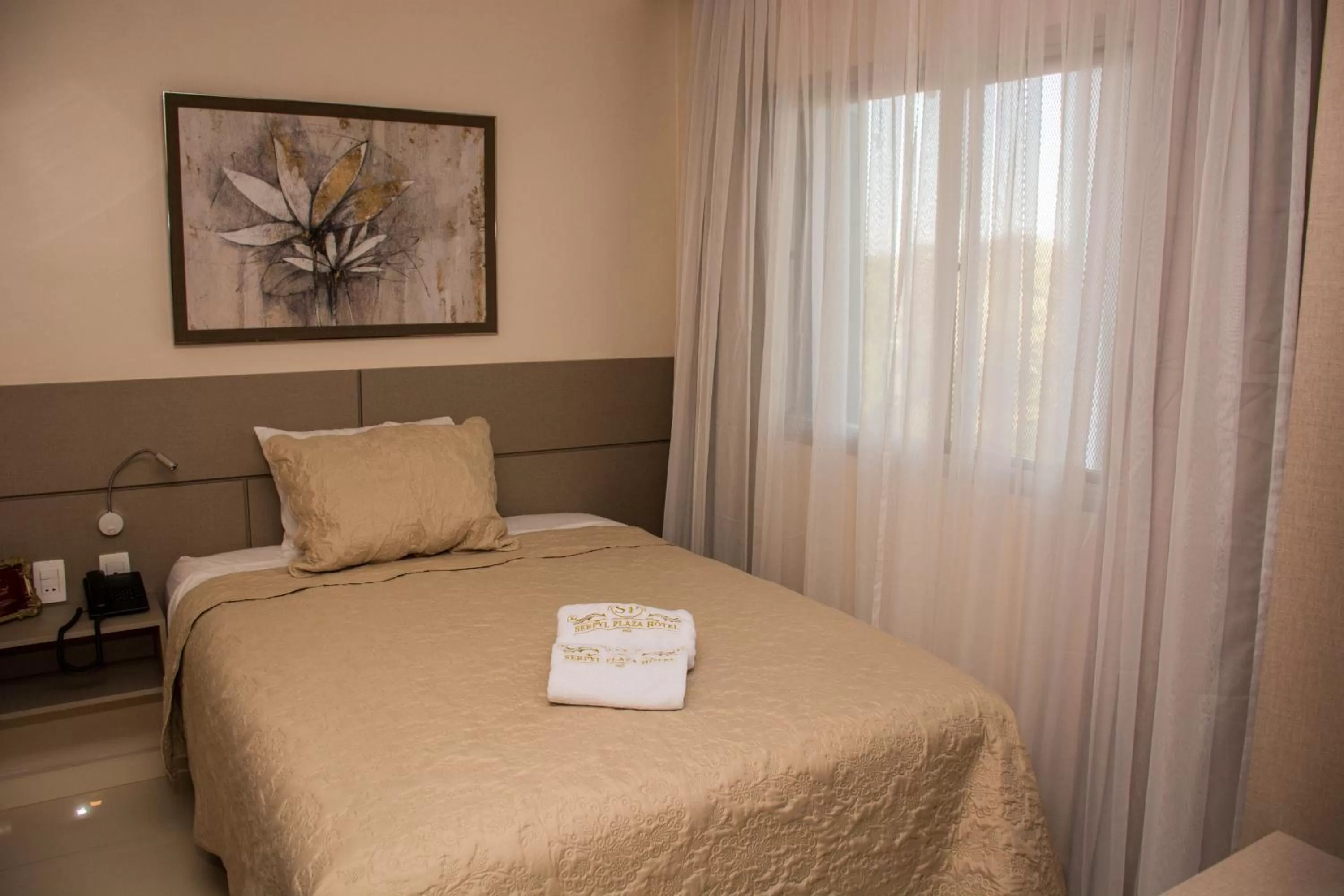 Bed in SERPYL Plaza Hotel