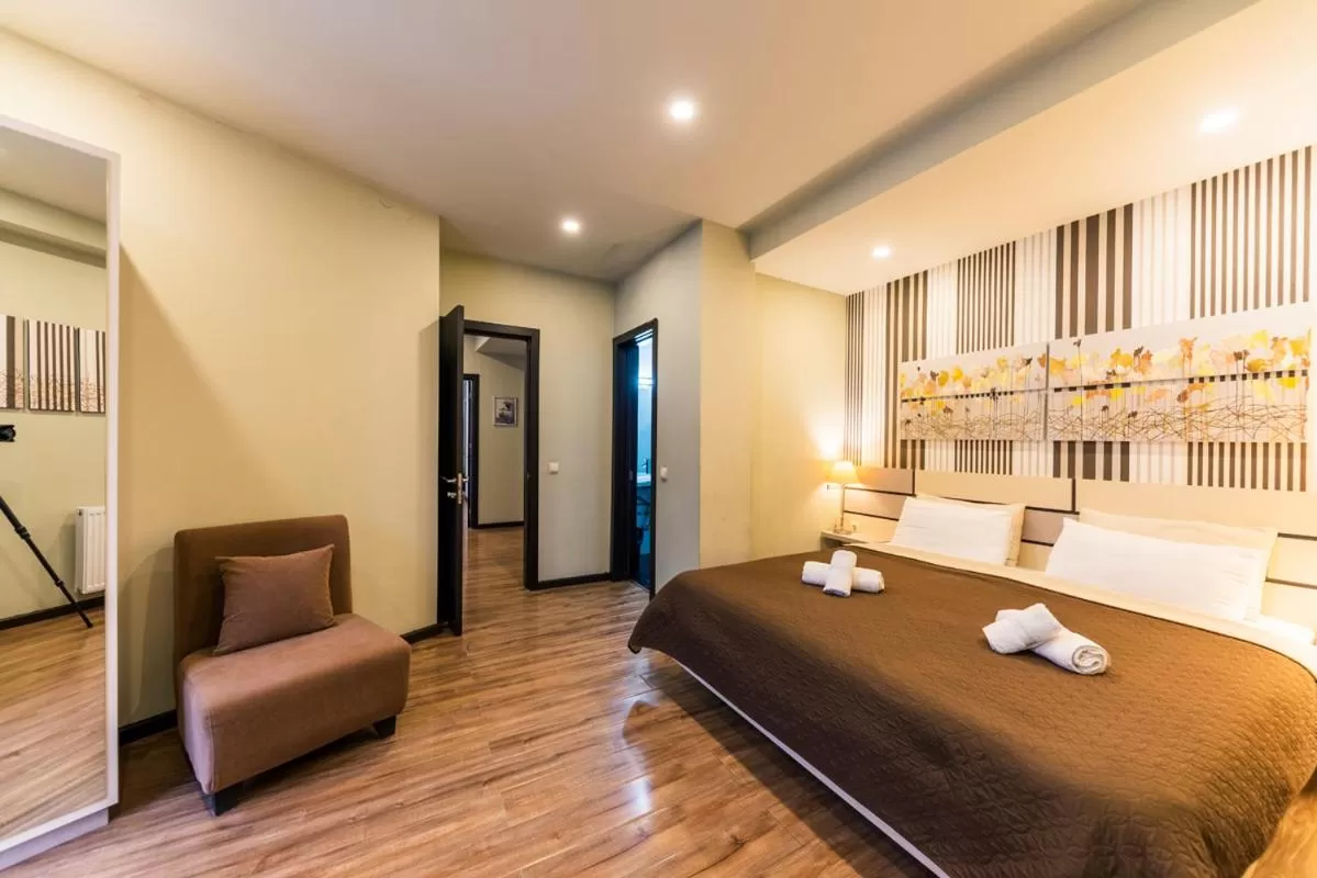 Bed in Sani Apart Hotel