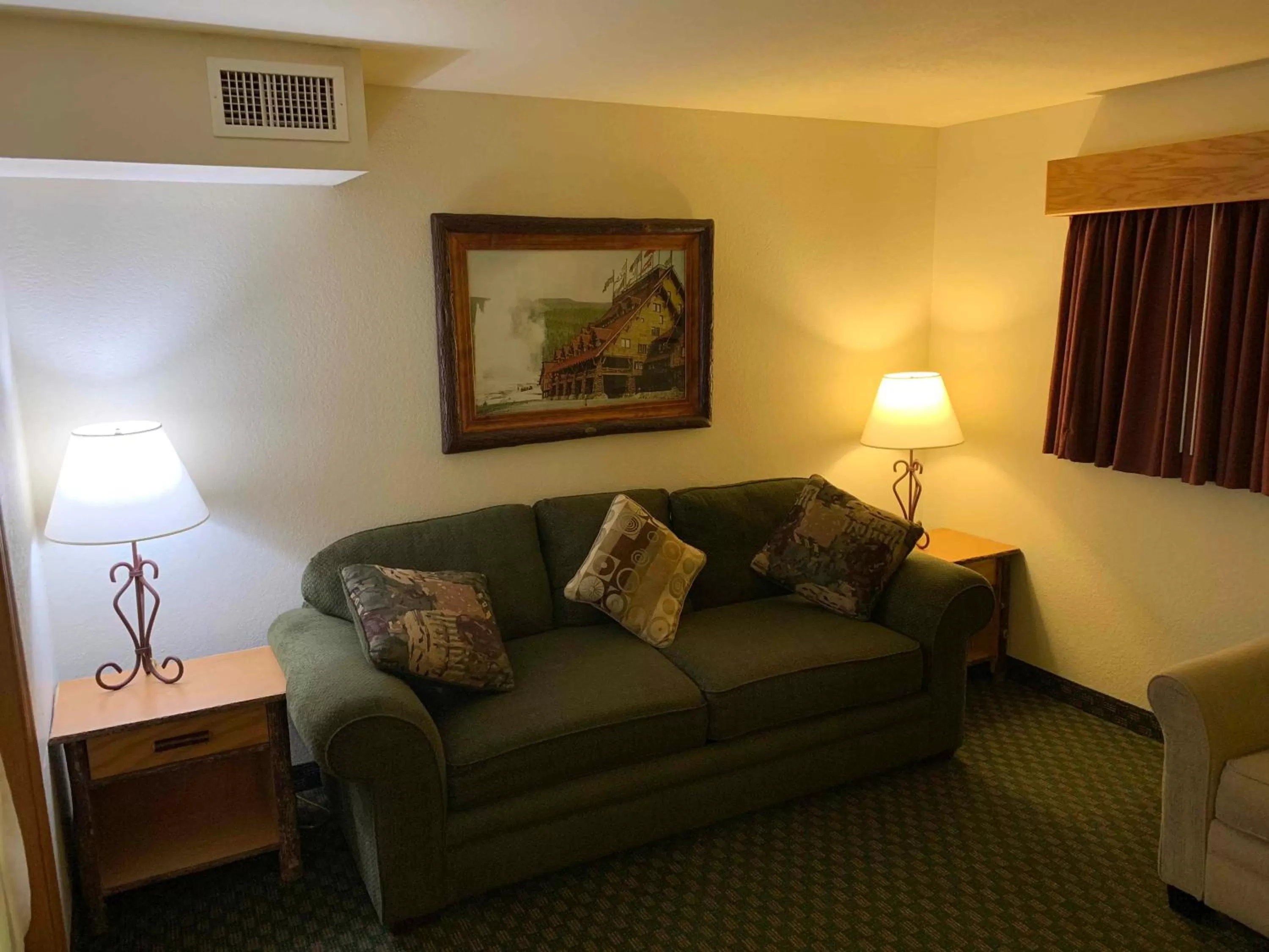 Seating area in AmericInn by Wyndham Cody