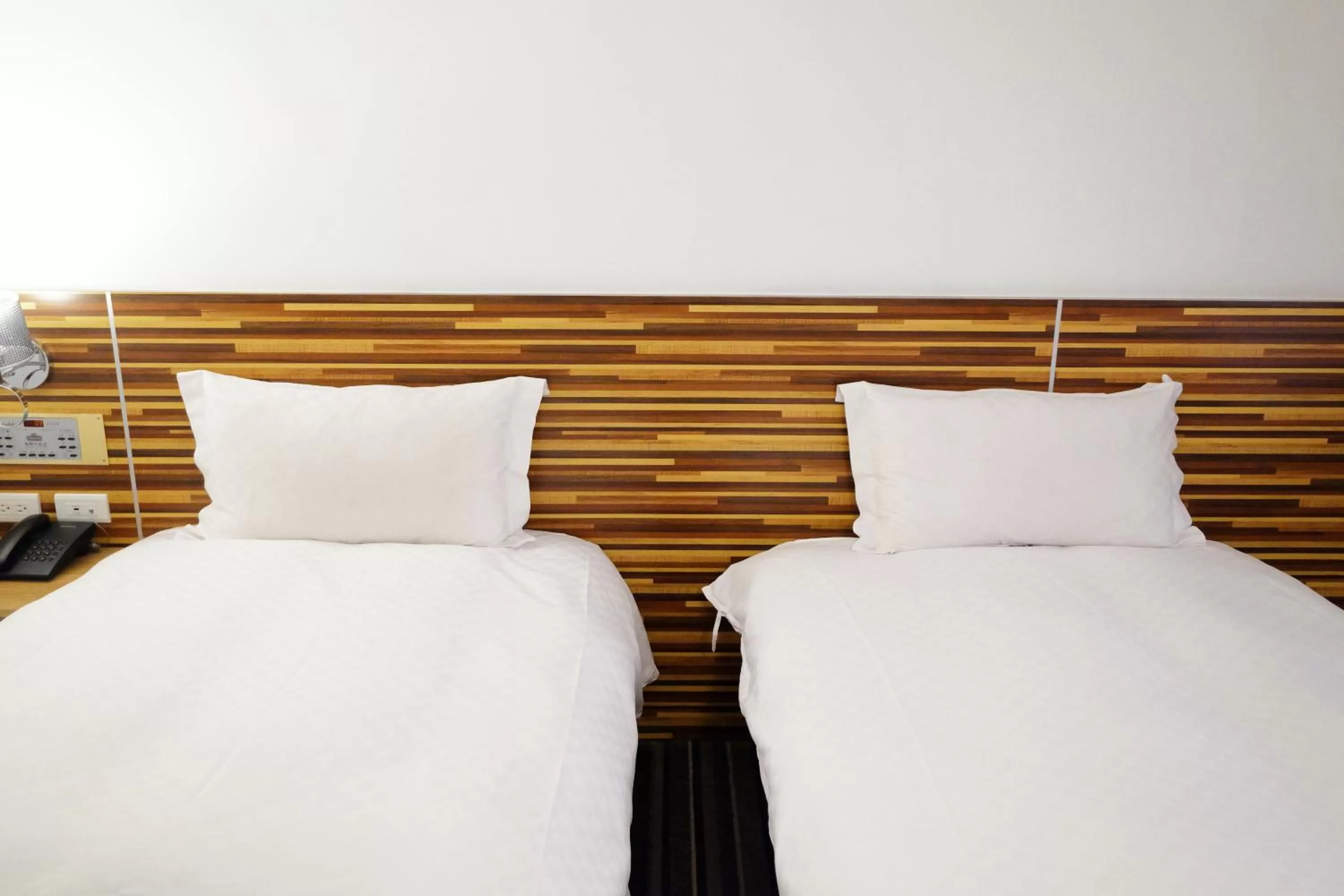 Bed in Dynasty Hotel