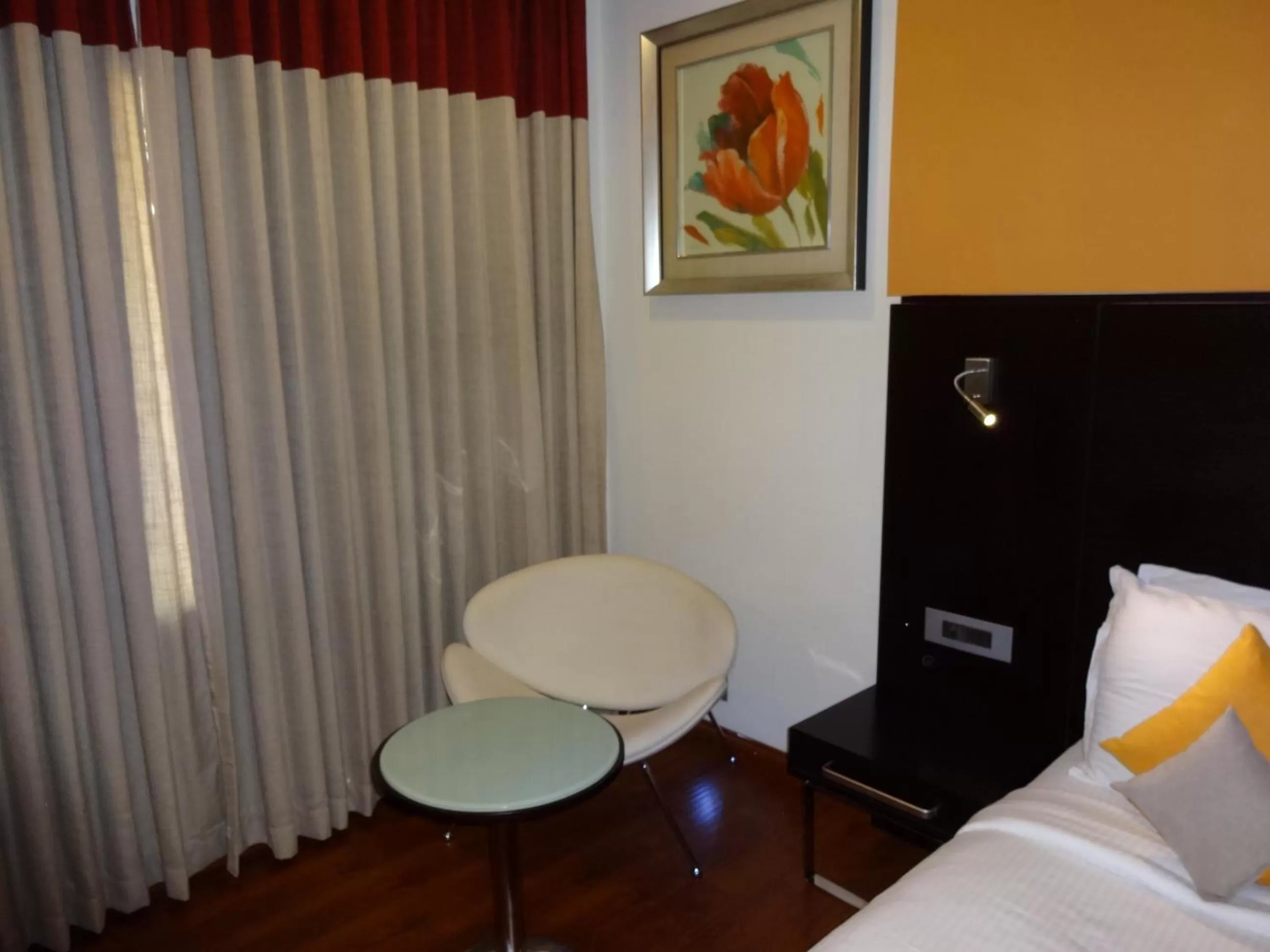 Seating area, Bed in Astoria Hotels Madurai