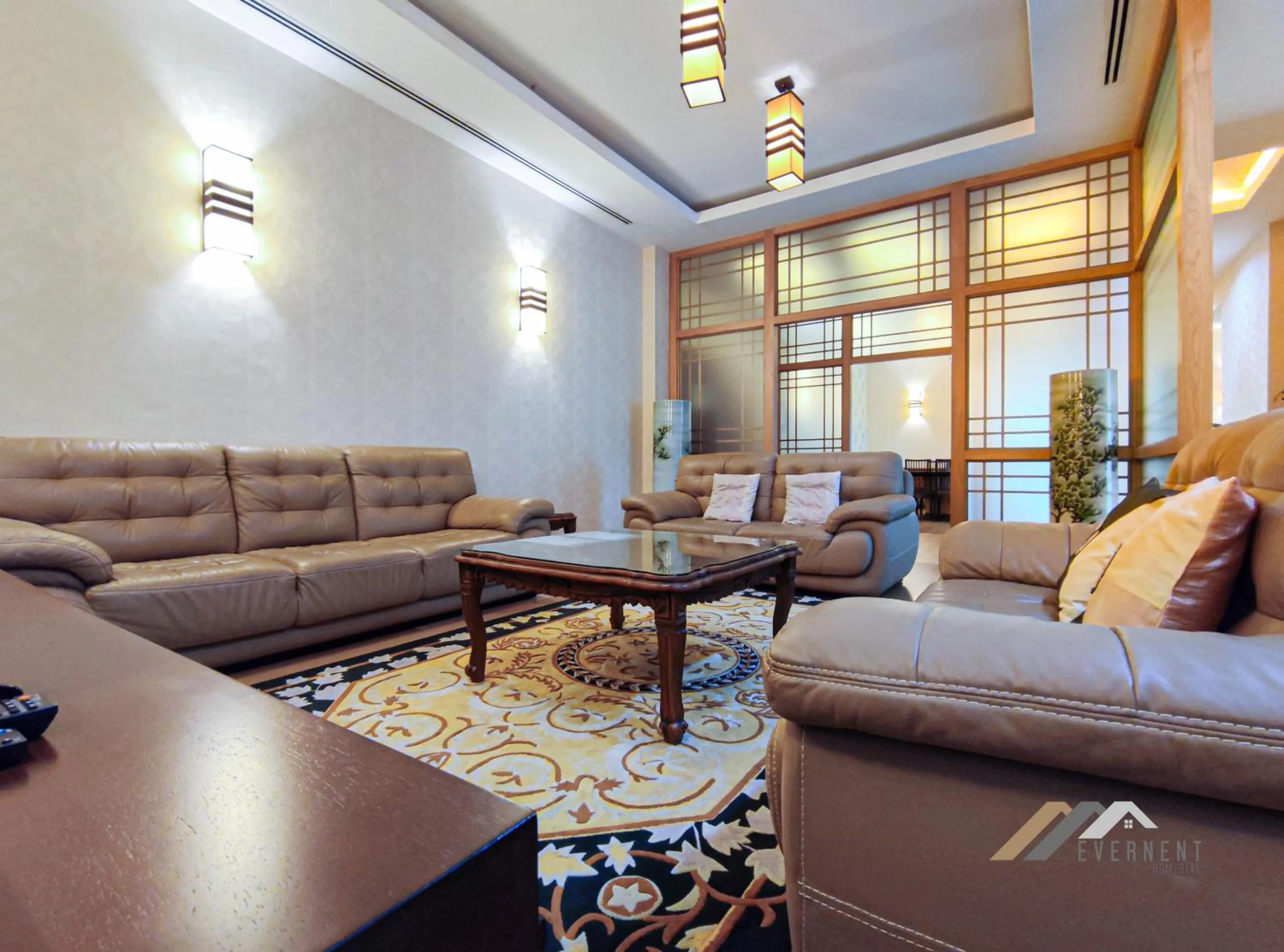 Living room in Mciti Suites by Evernent