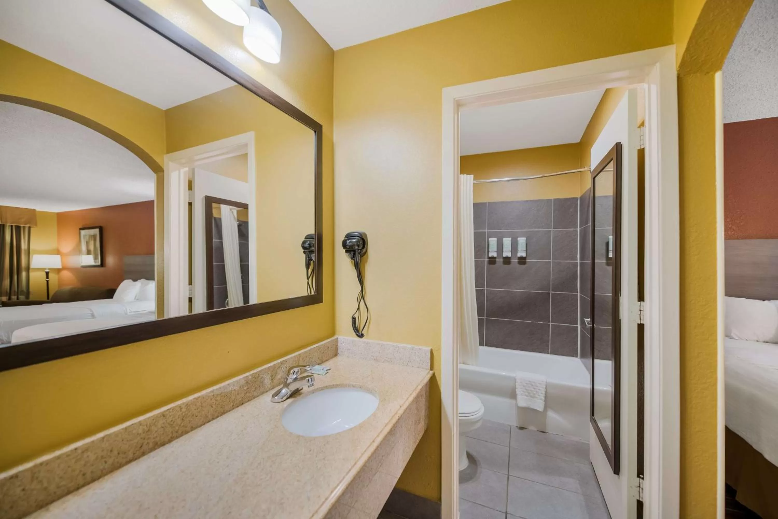 Bathroom, Bed in SureStay Hotel by Best Western Mt Pleasant