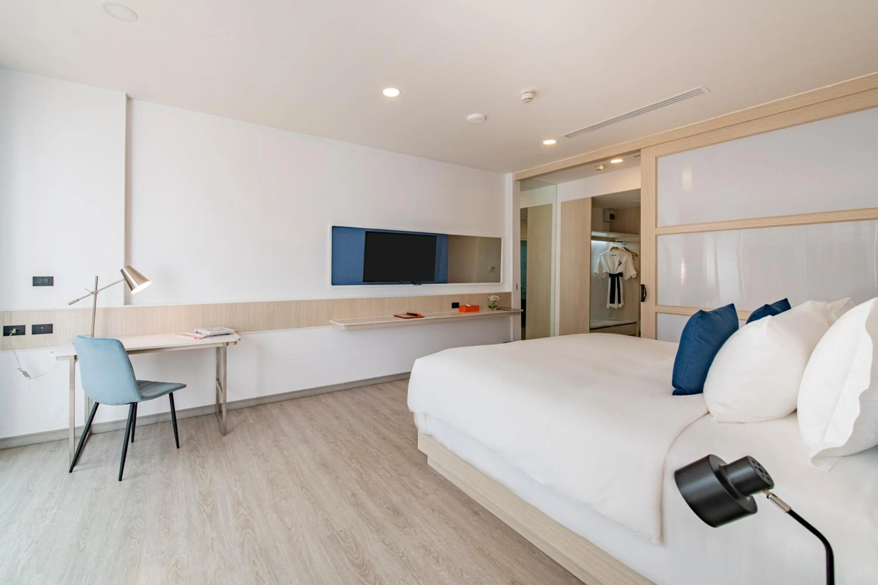 Bed in NH Boat Lagoon Phuket Resort