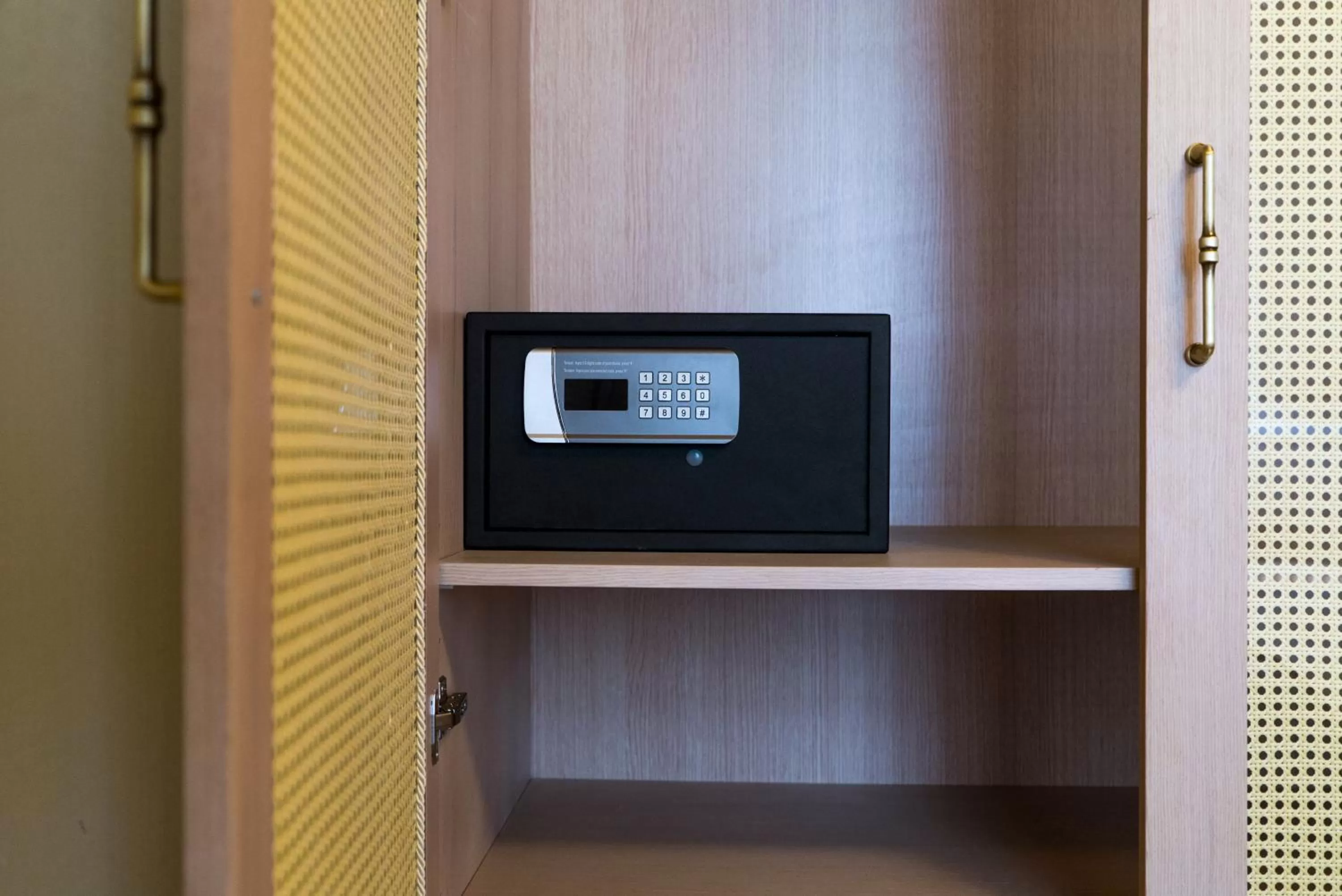 safe, TV/Entertainment Center in Magnova Vitality Boutique Hotel