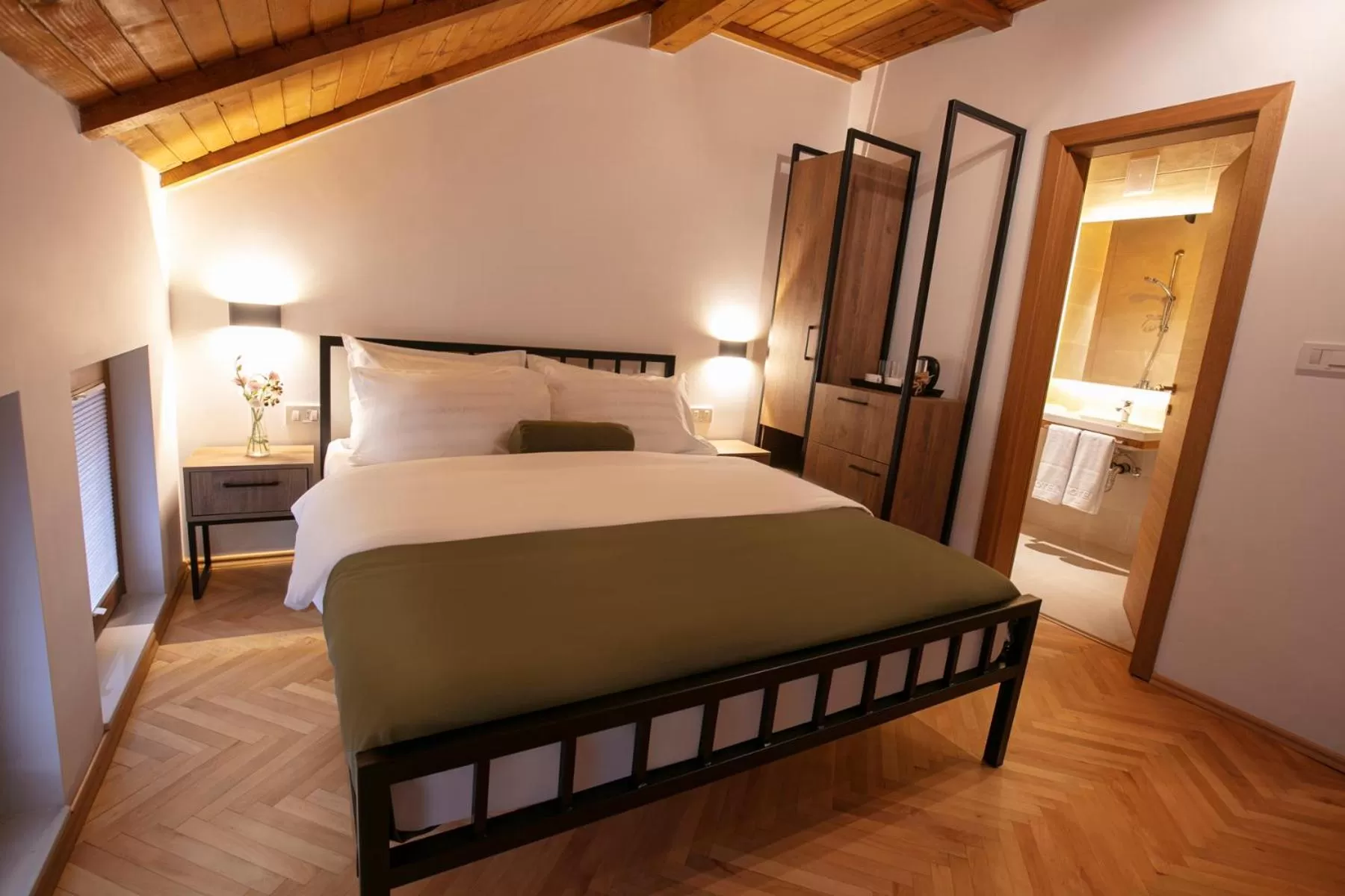 Bed in Grand Boutique Hotel