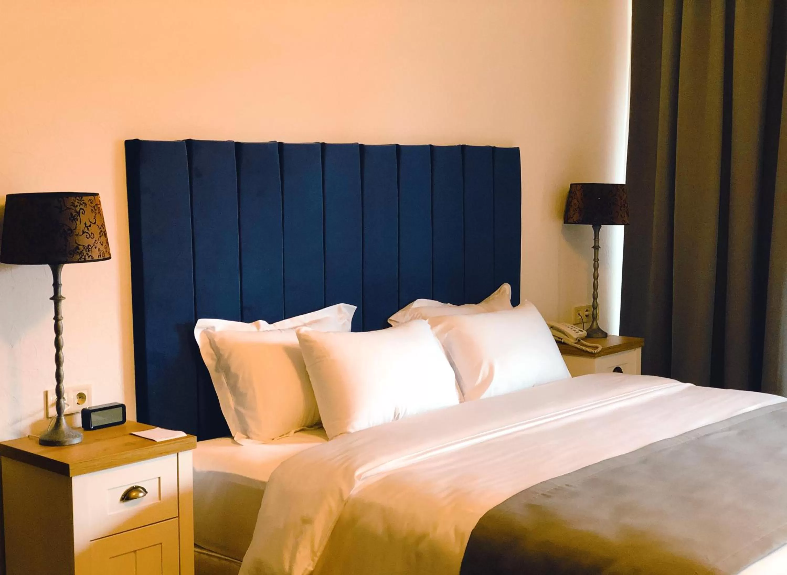 Bed in Octava Boutique Hotel