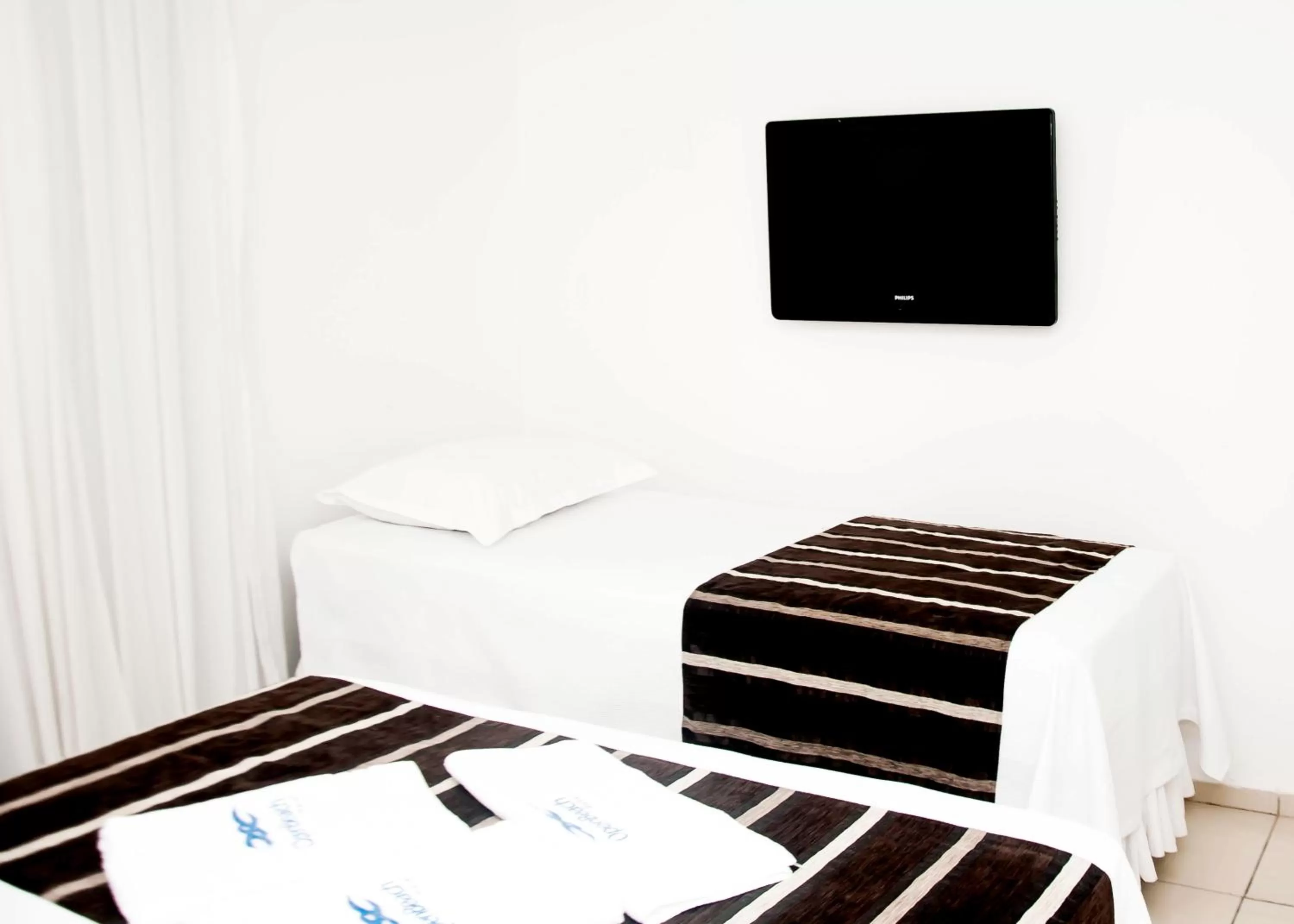 Bed, Room Photo in Tirol Praia Hotel