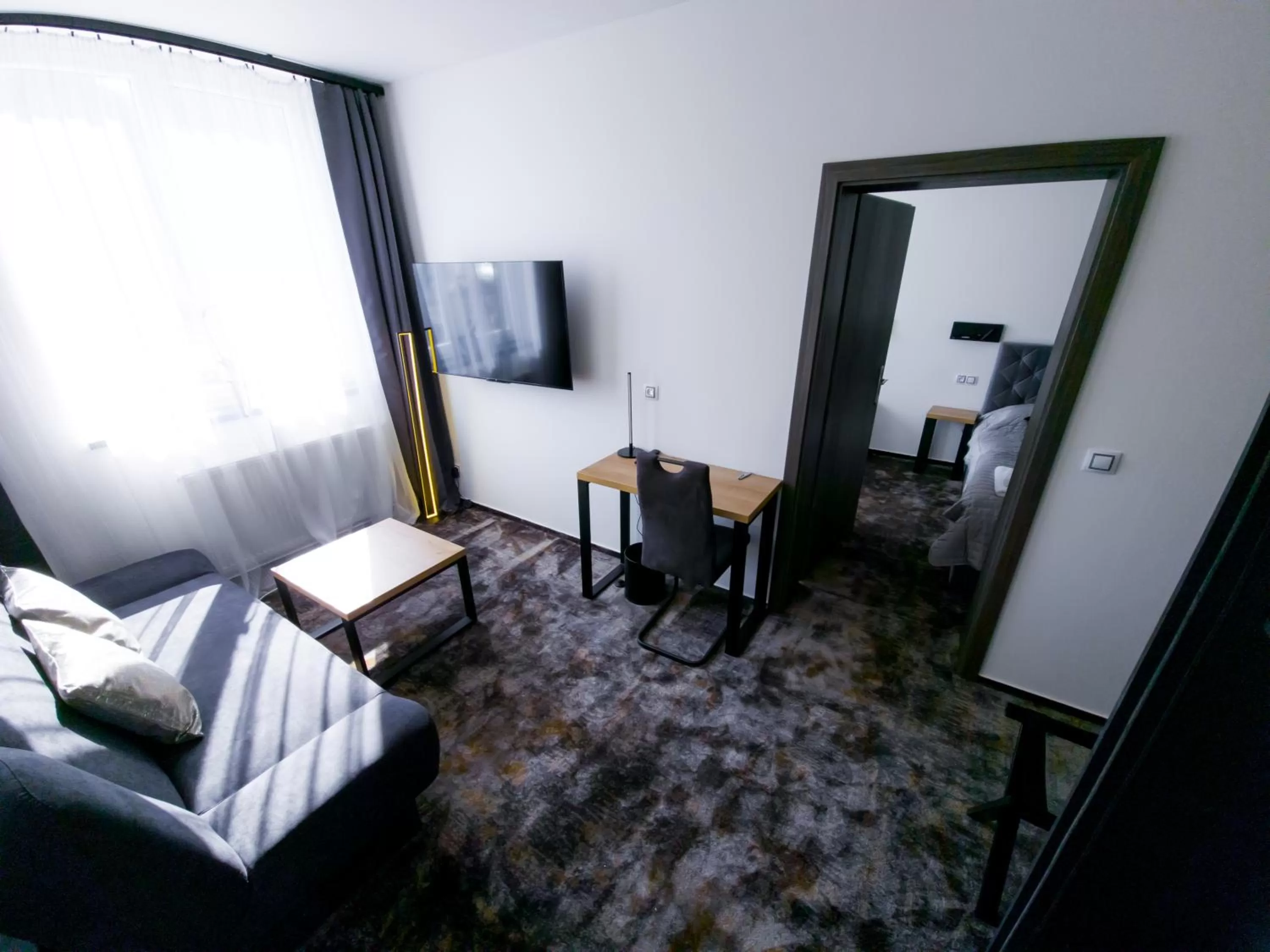 Living room, Bed in Olympland Hotel