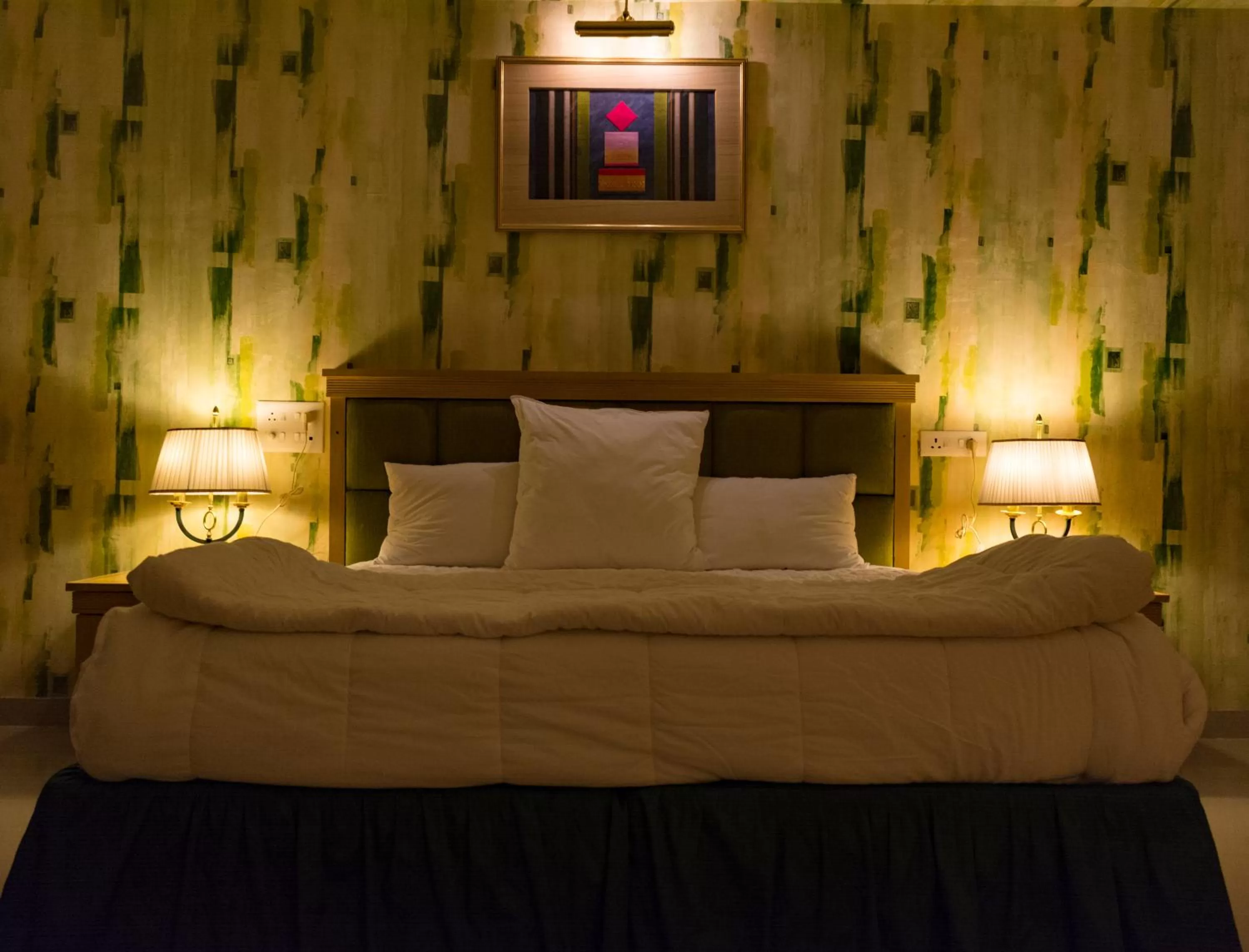 Bed in Mango Valley Resort Ganpatipule