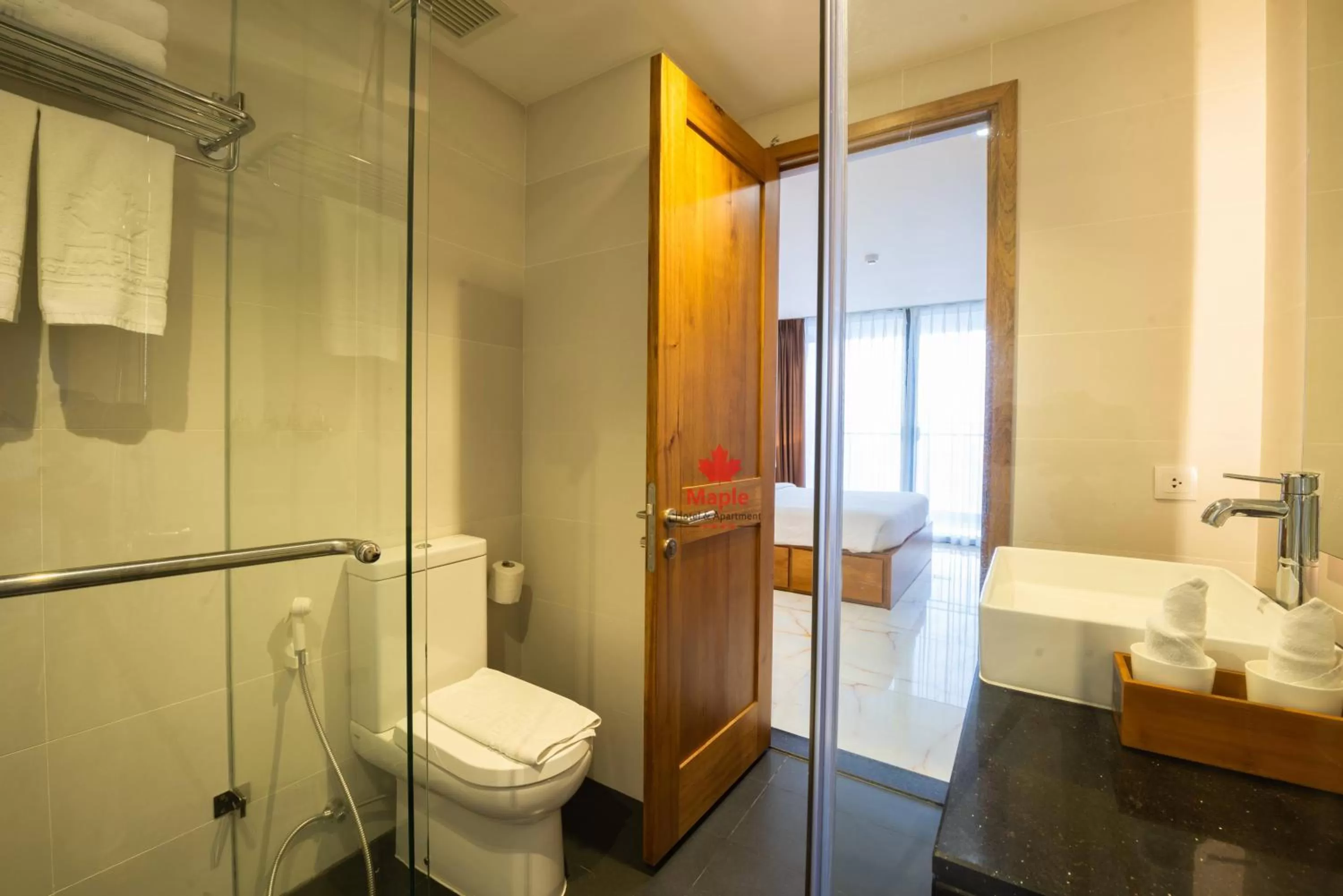 Bathroom in Maple Hotel & Apartment