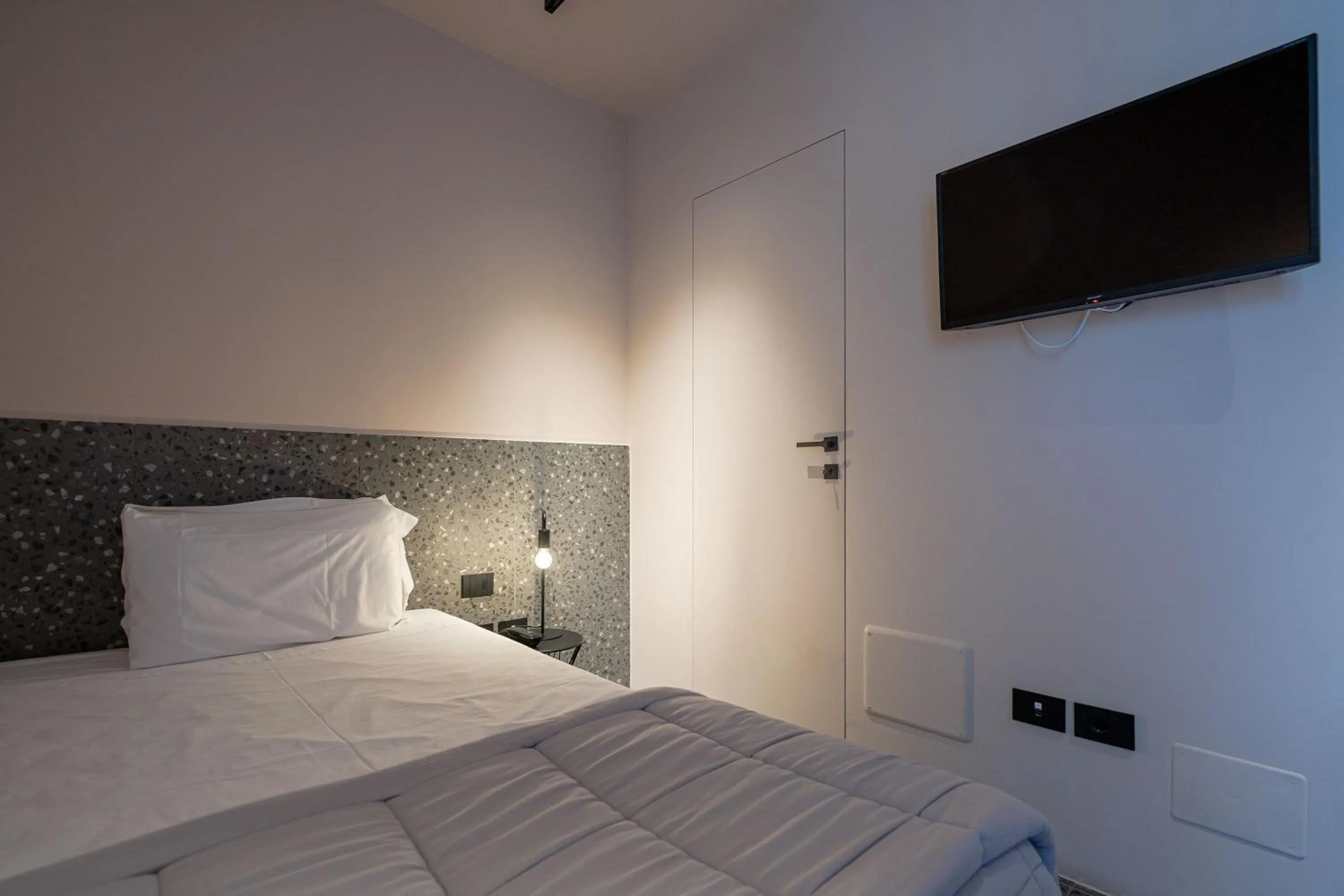 Bed in Elide Design Hotel