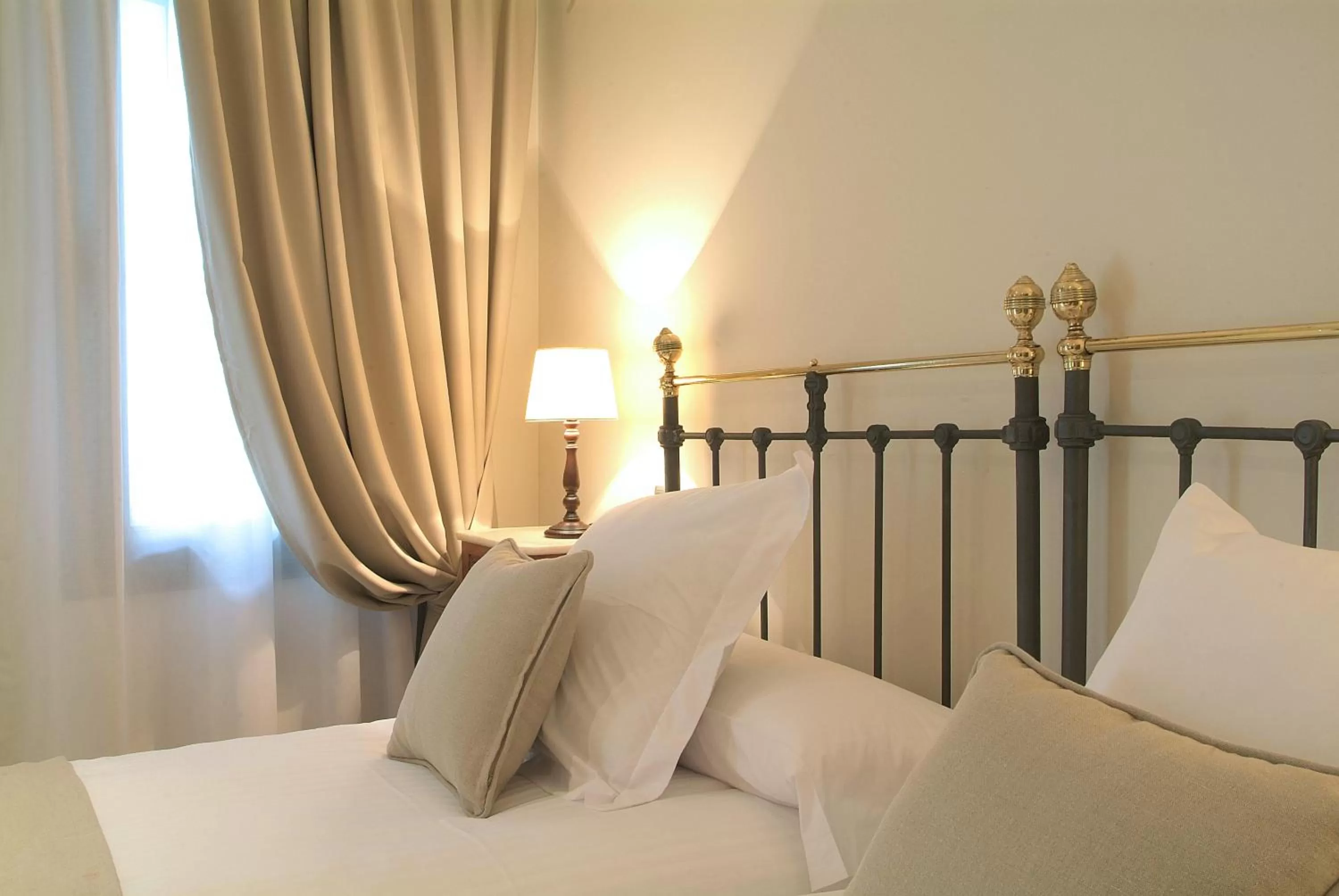 Bed in Le Petit Boutique Hotel