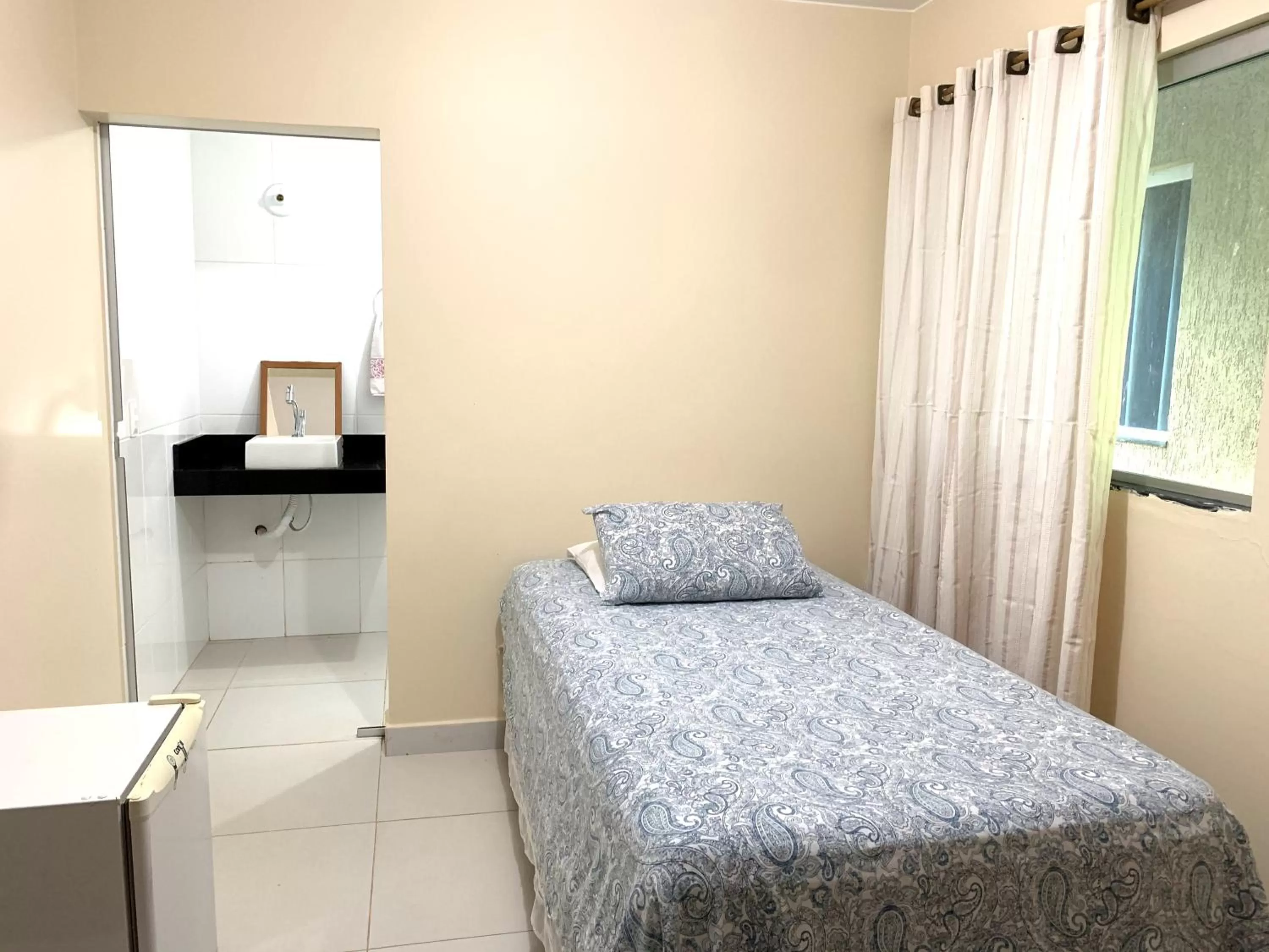 Bed in Pousada Jardim Brasília