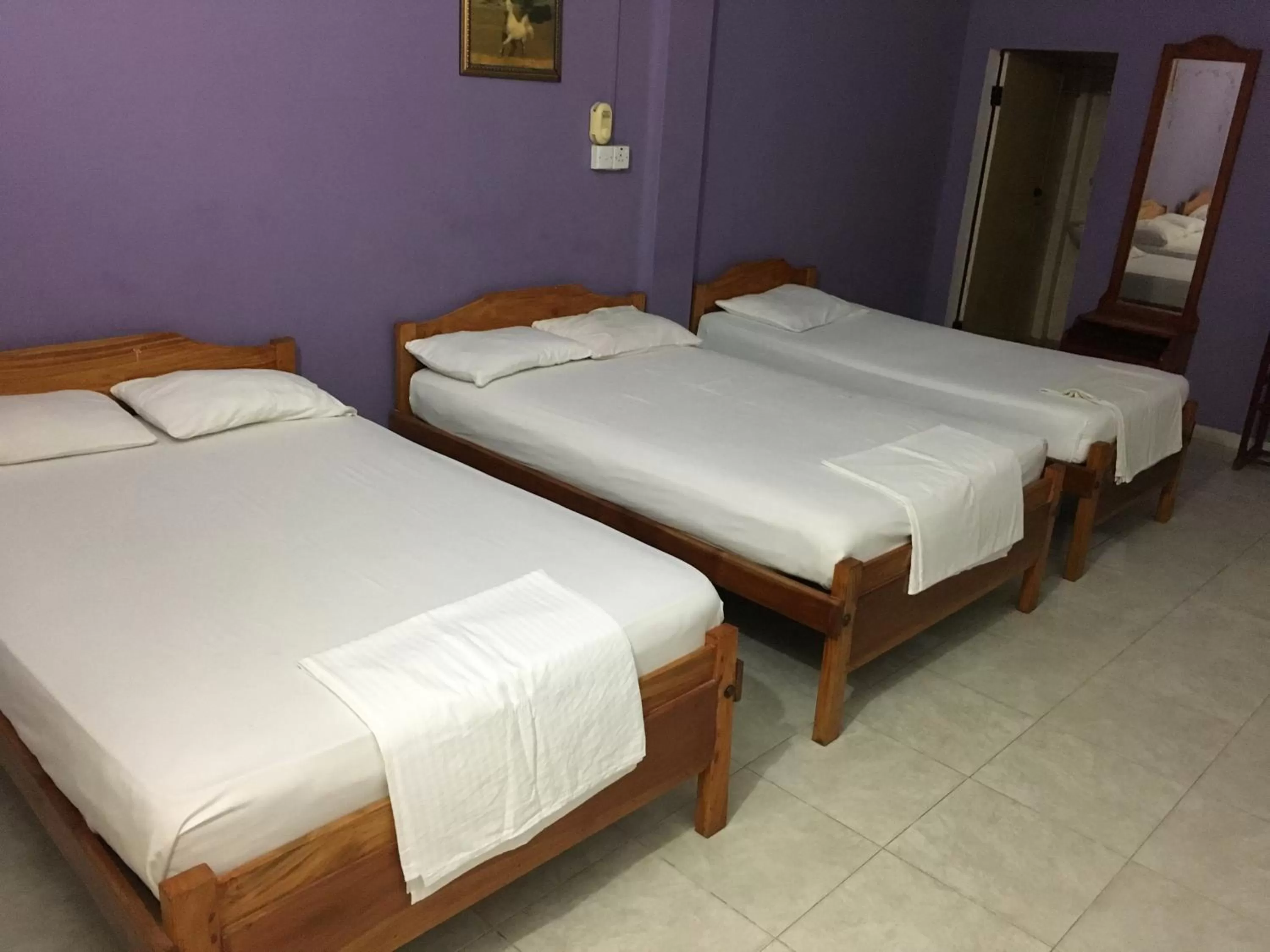 Bed in Gnaanams Hotel and Restaurant