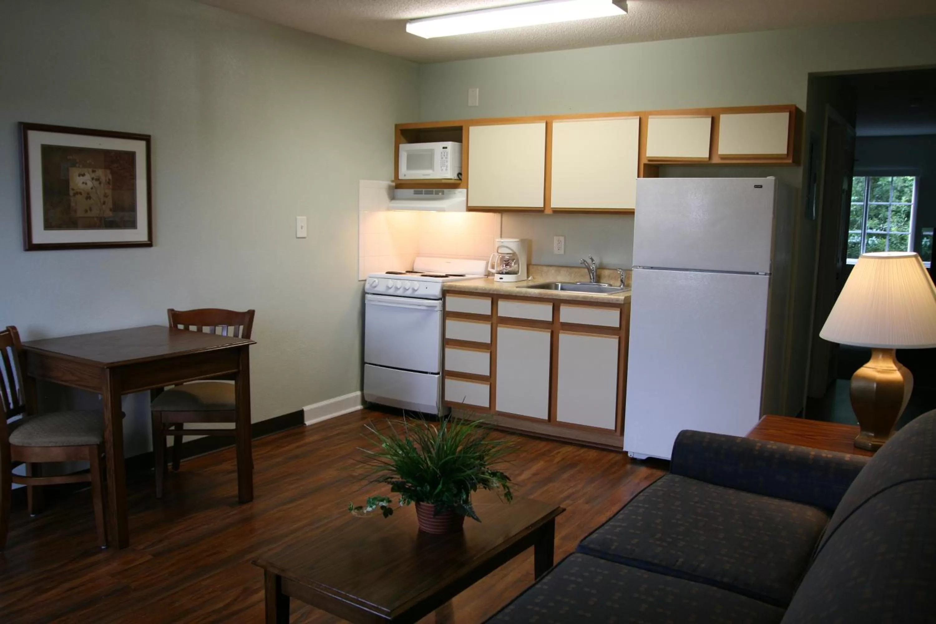 Kitchen or kitchenette in Affordable Suites Jacksonville