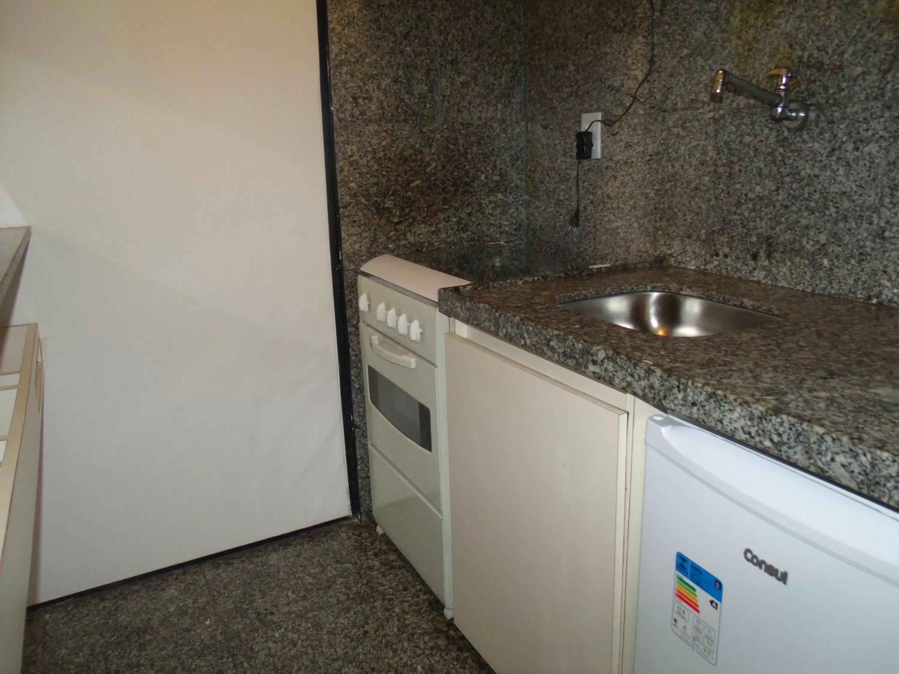 Kitchen or kitchenette in Iracema Residence Hotel Flat