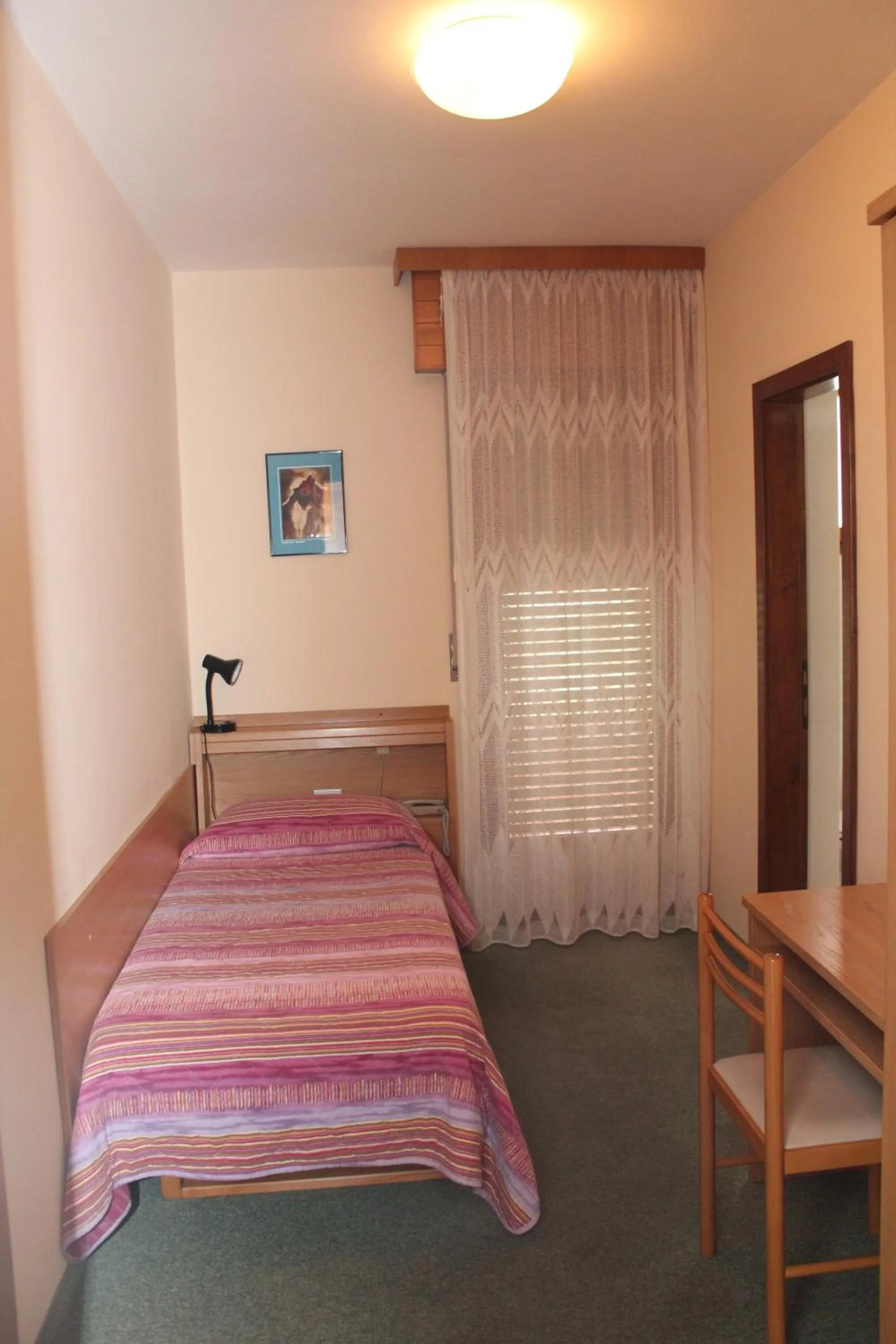 Decorative detail, Bed in Garnì Casa Rabagno