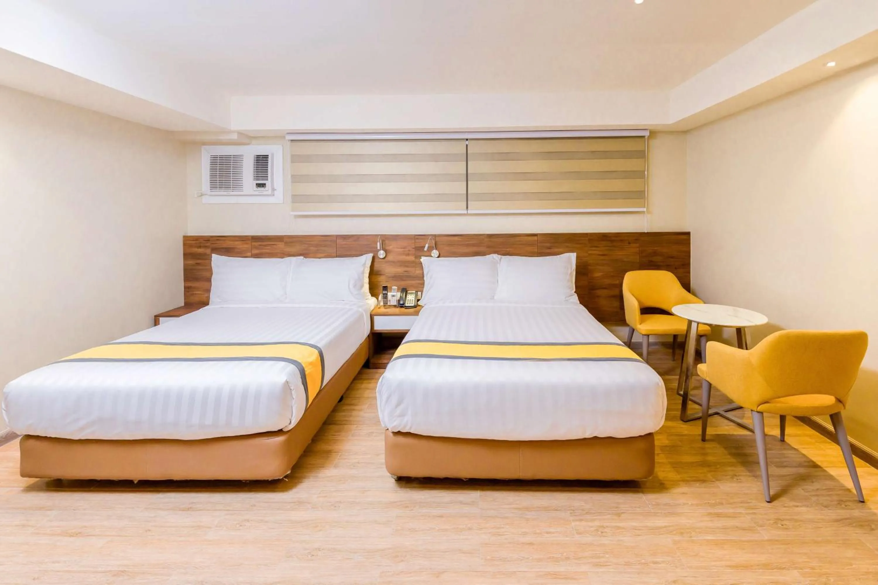 Photo of the whole room, Bed in SureStay Plus by Best Western Cebu City