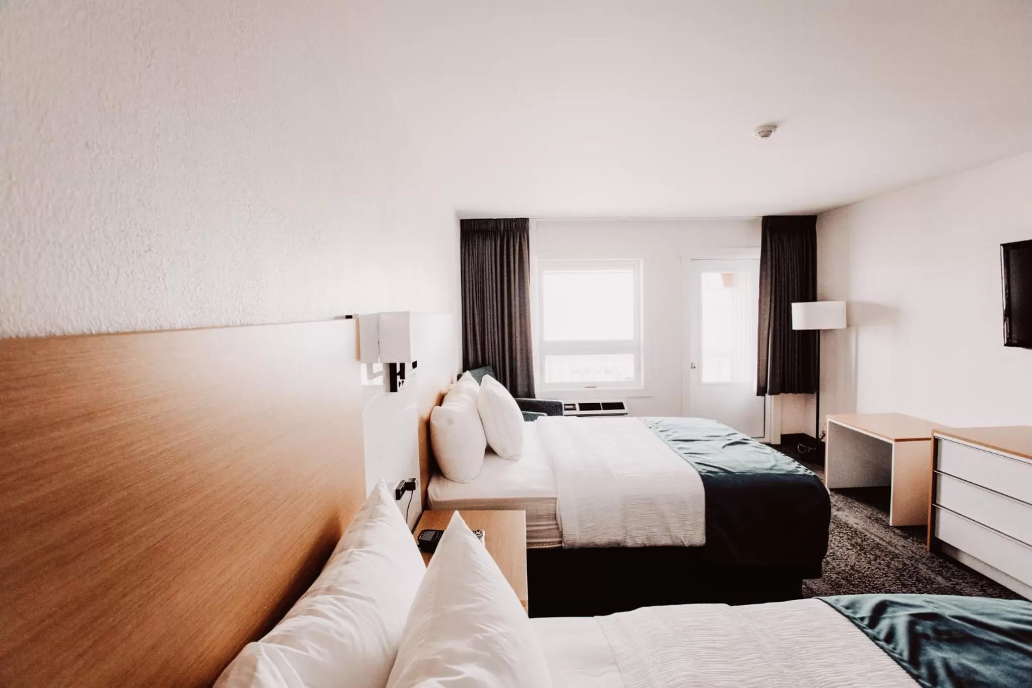 Bed in La Place Rendez-Vous Hotel