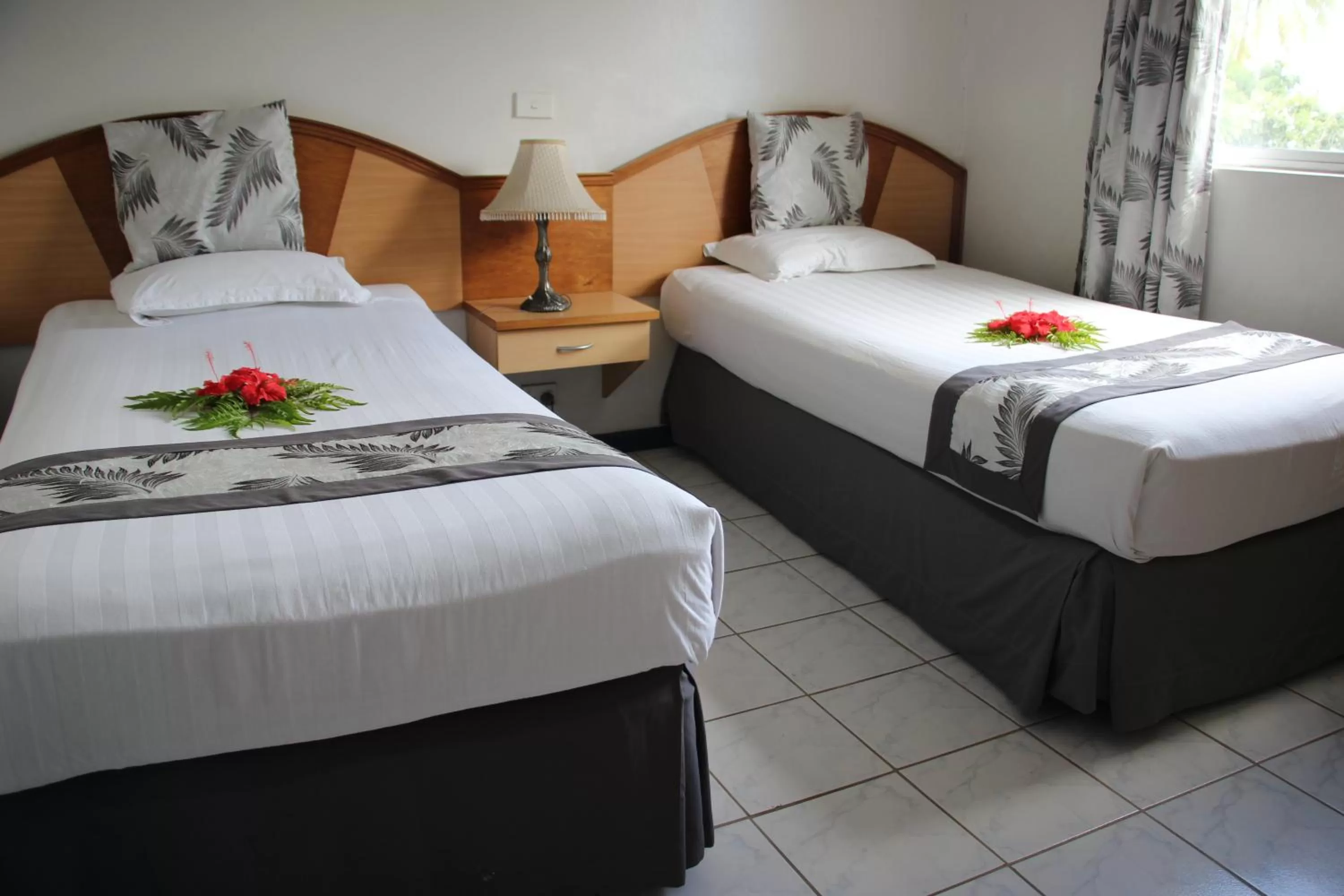 Bed in Capricorn International Hotel