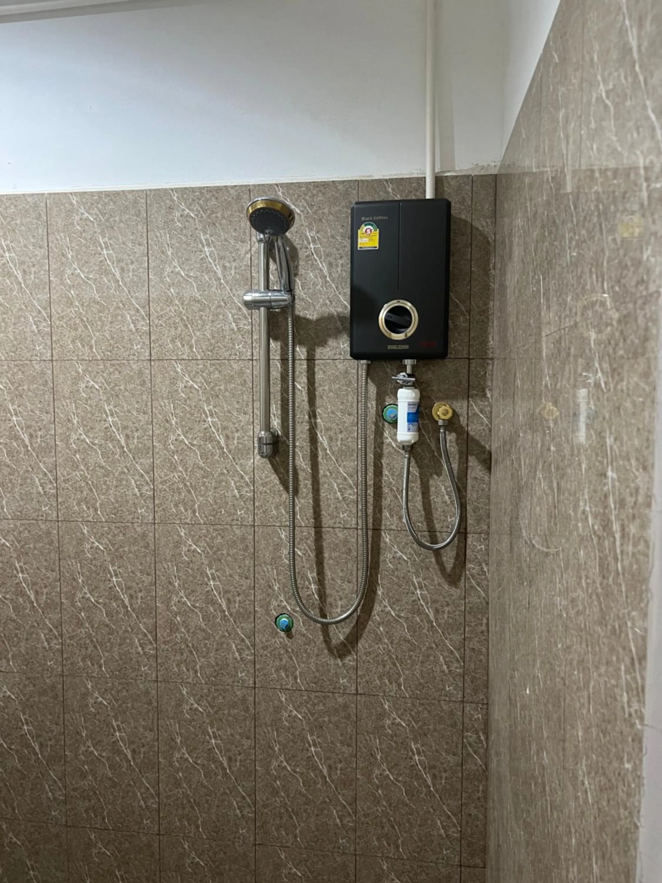 Shower in Mall Suites Hotel