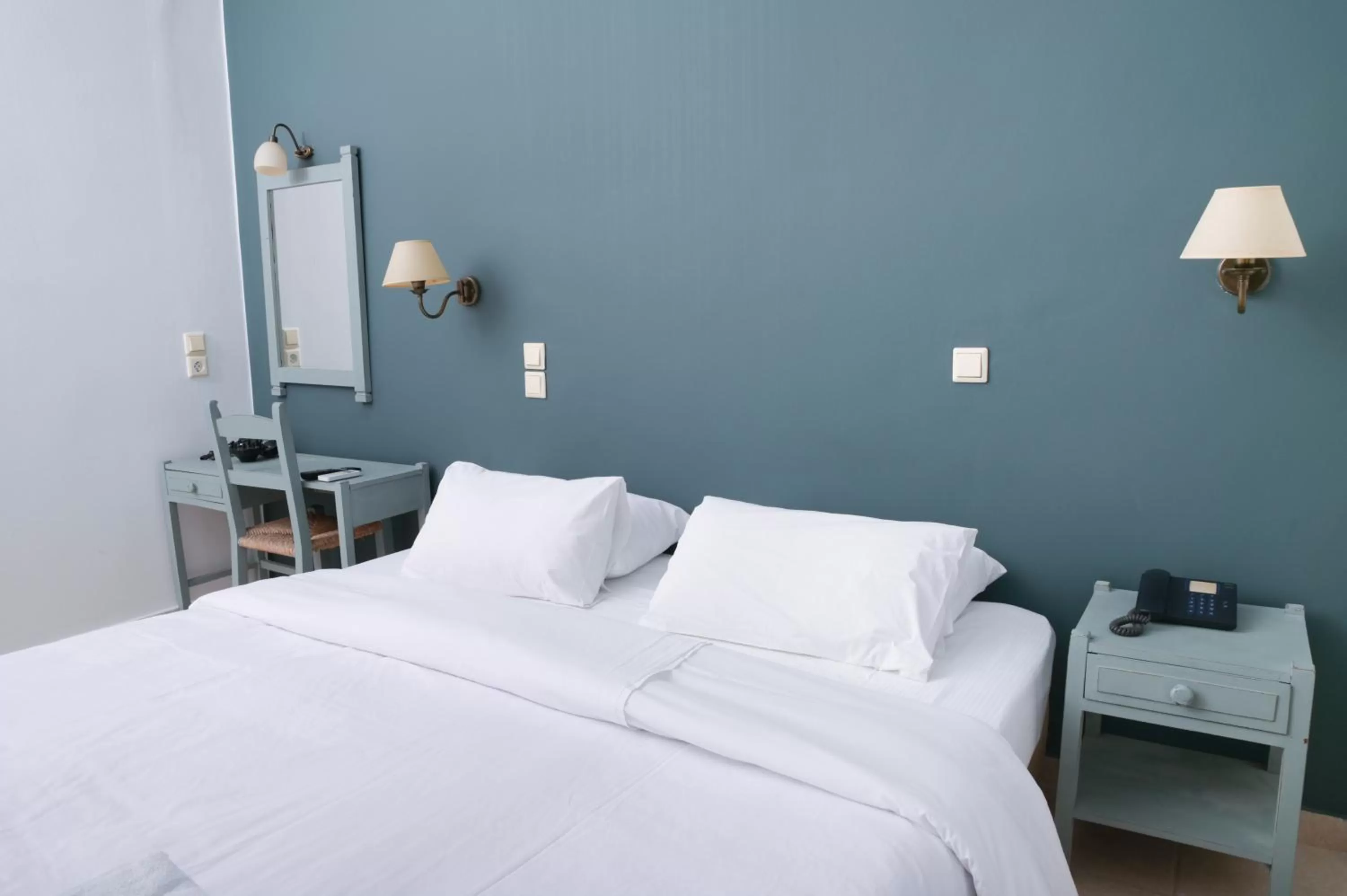 Bed in Ikaros Art Hotel