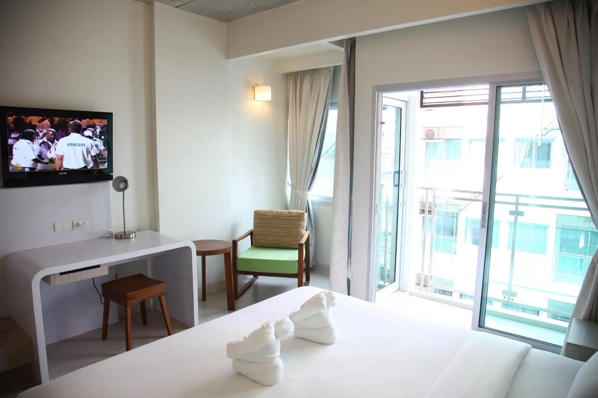 Bed in Sunshine Hotel & Residences