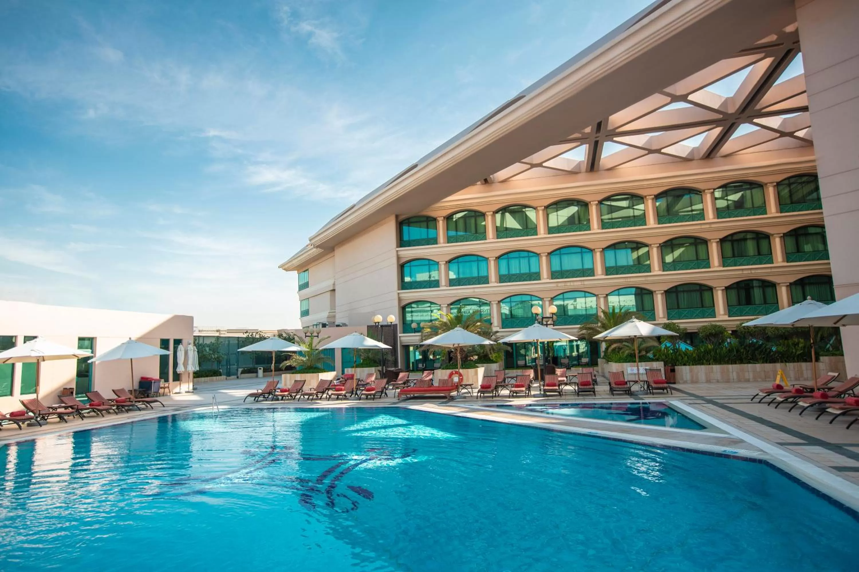 Swimming pool in Mövenpick Grand Al Bustan