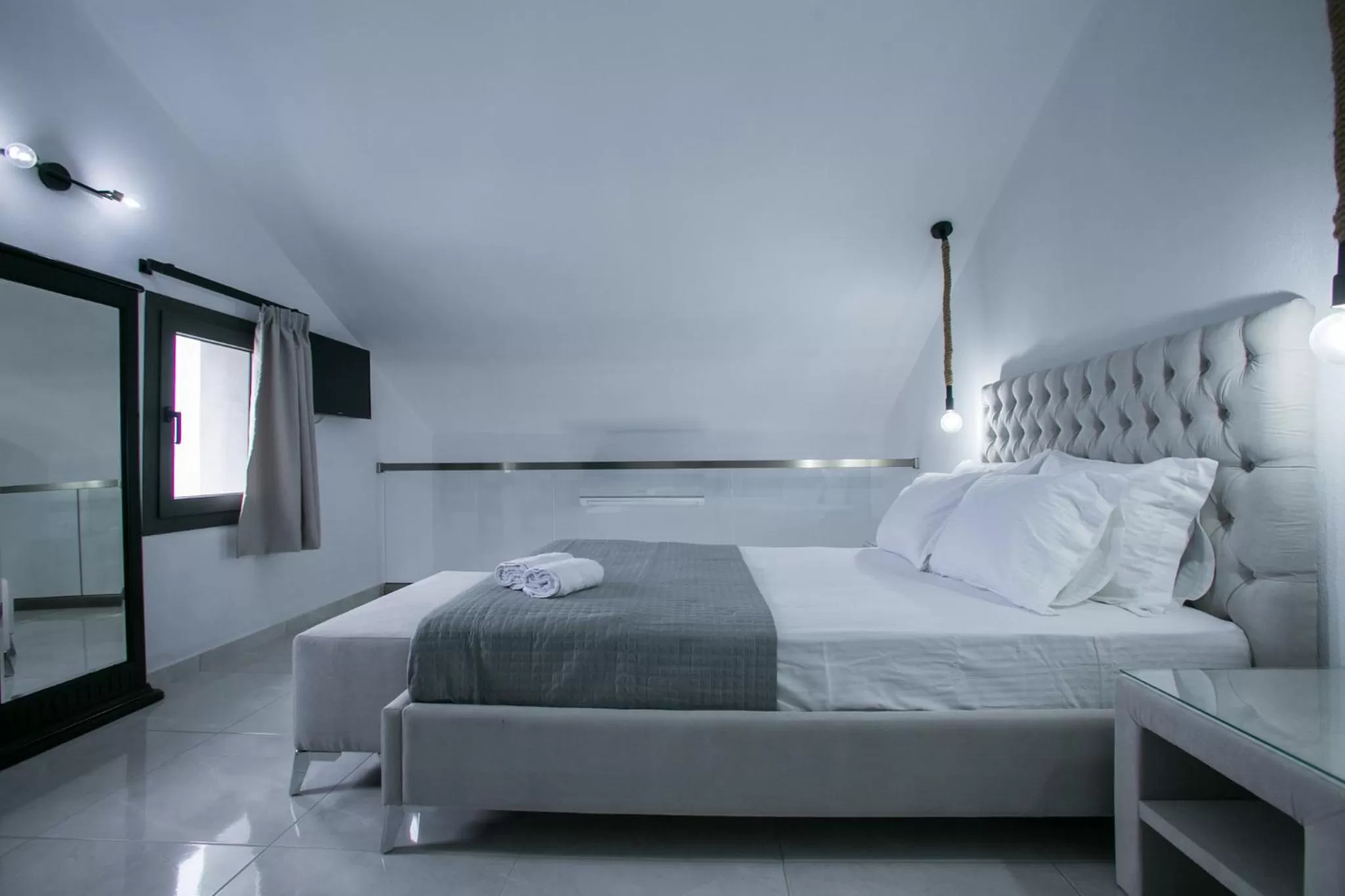 Bed in Anemos Luxury Apartments