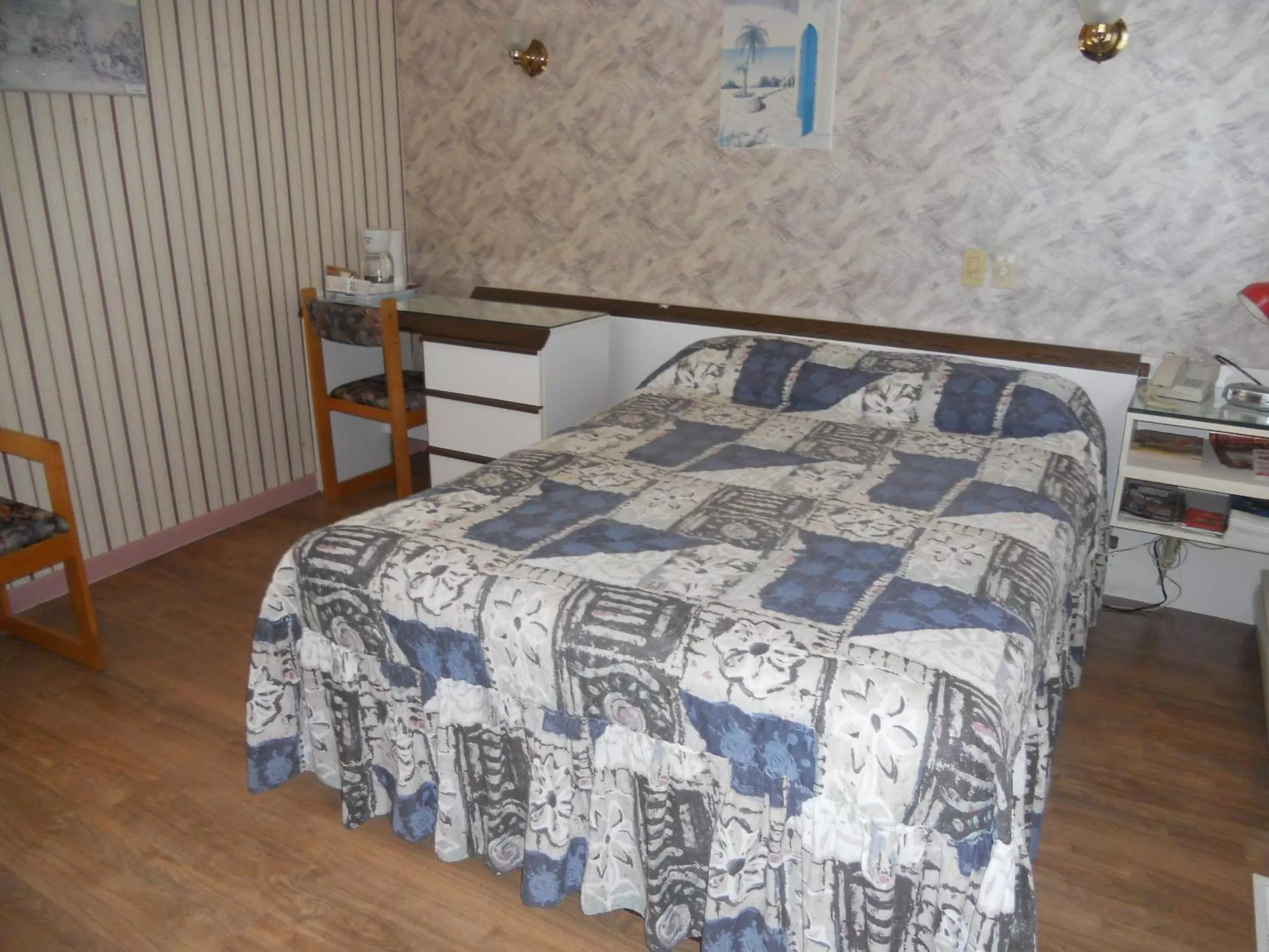 Bed in Motel Normandie