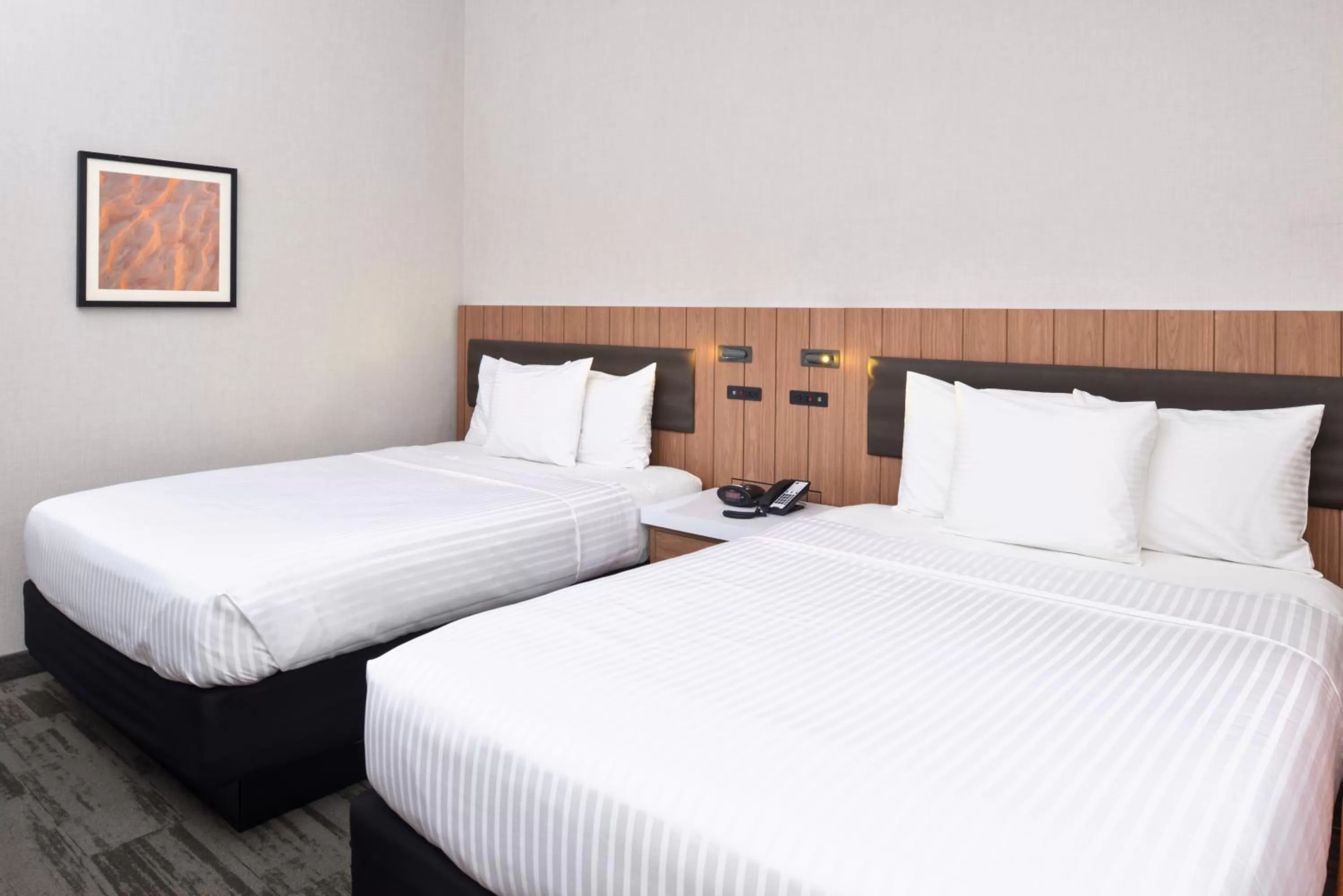 Bed in Modesto Hotel - Gateway to Yosemite