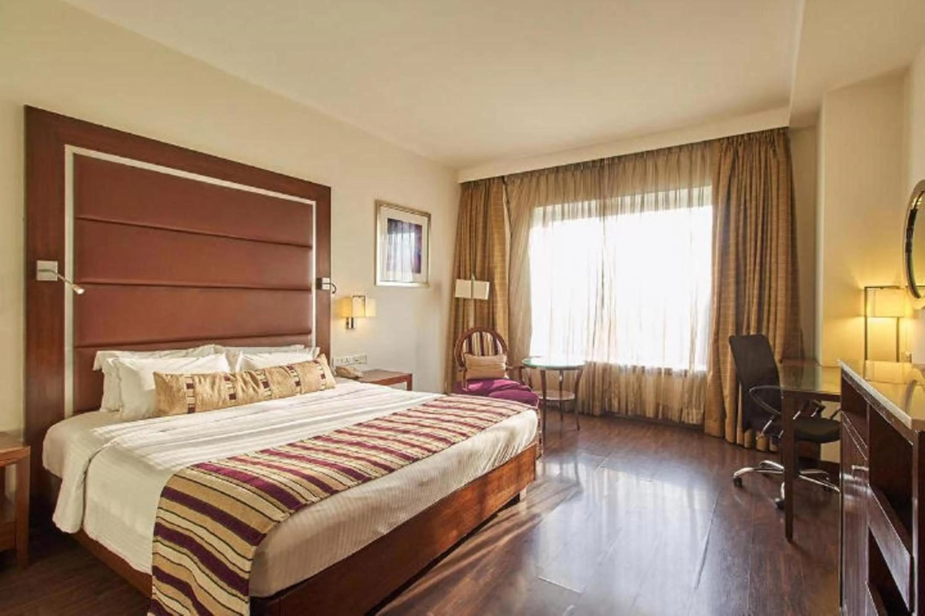 Bedroom, Bed in Royal Orchid Central, Pune