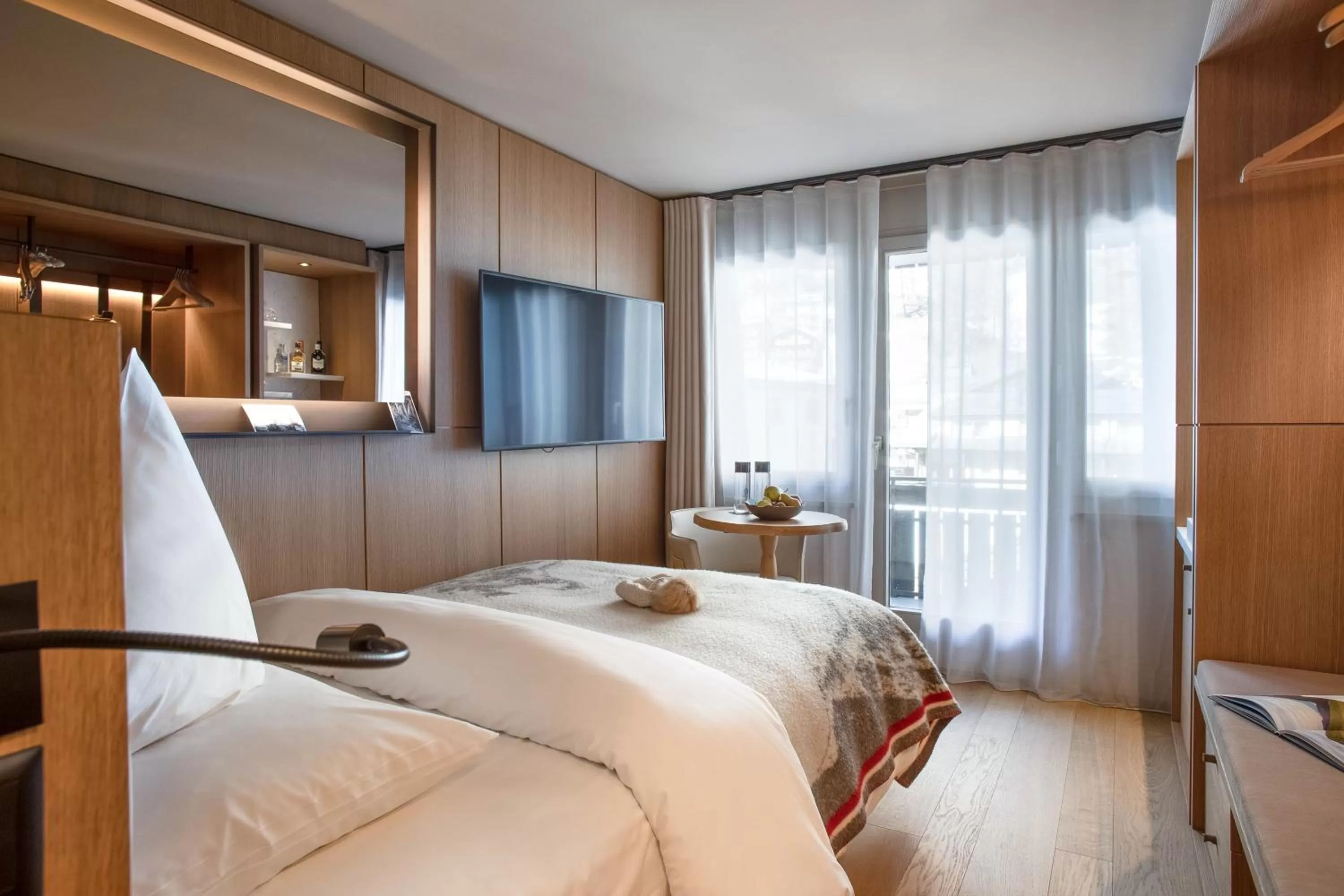 Photo of the whole room, Bed in Schweizerhof Zermatt - a Small Luxury Hotel