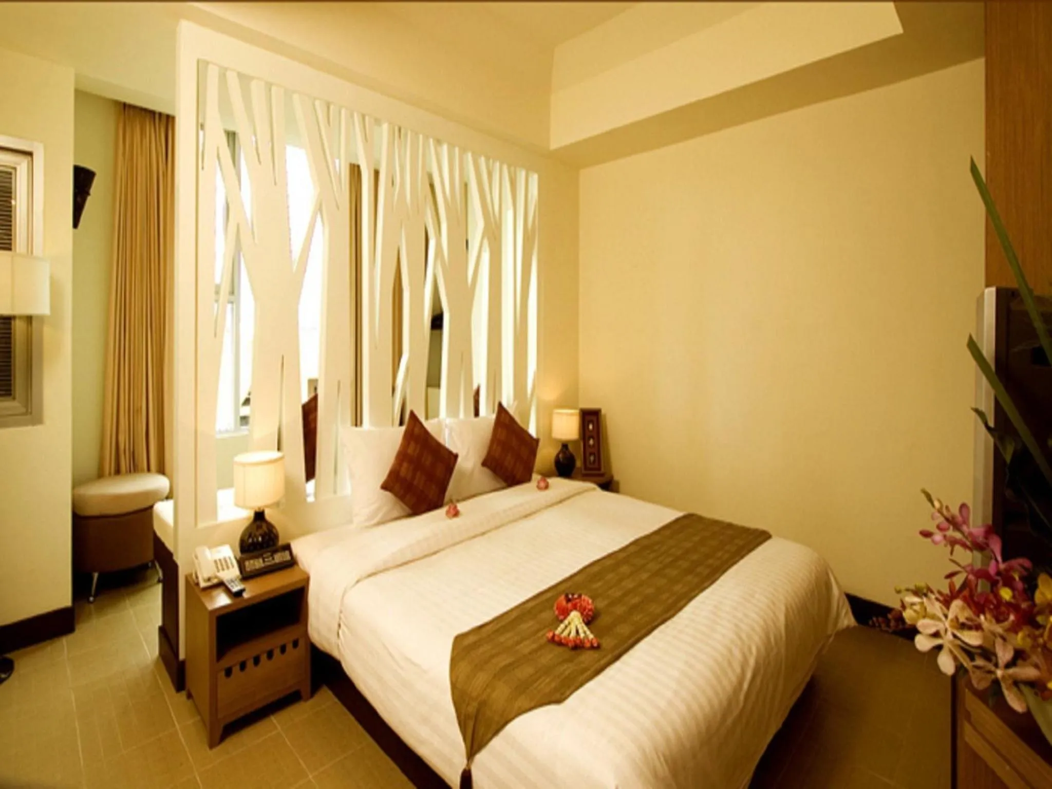 Bed in Maninarakorn Hotel